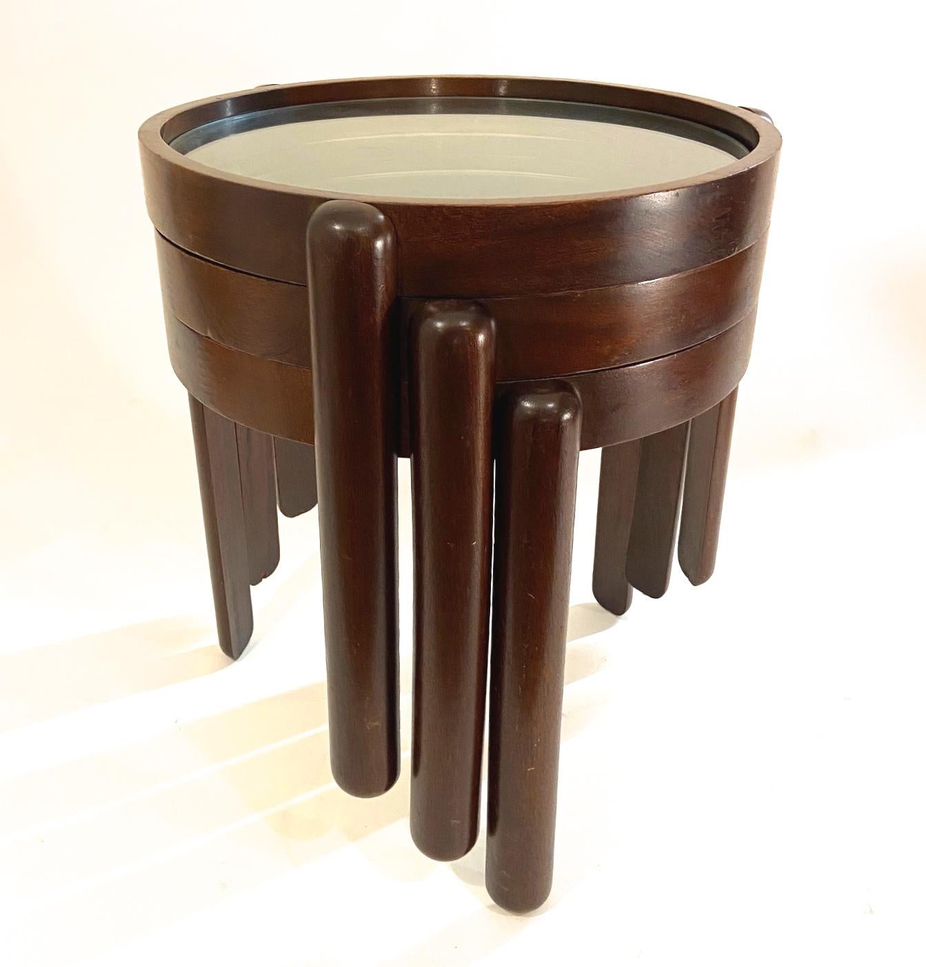 A set of three Italian nesting tables. Mahogany frame and glass tops. Excellent condition, 1960s edition.