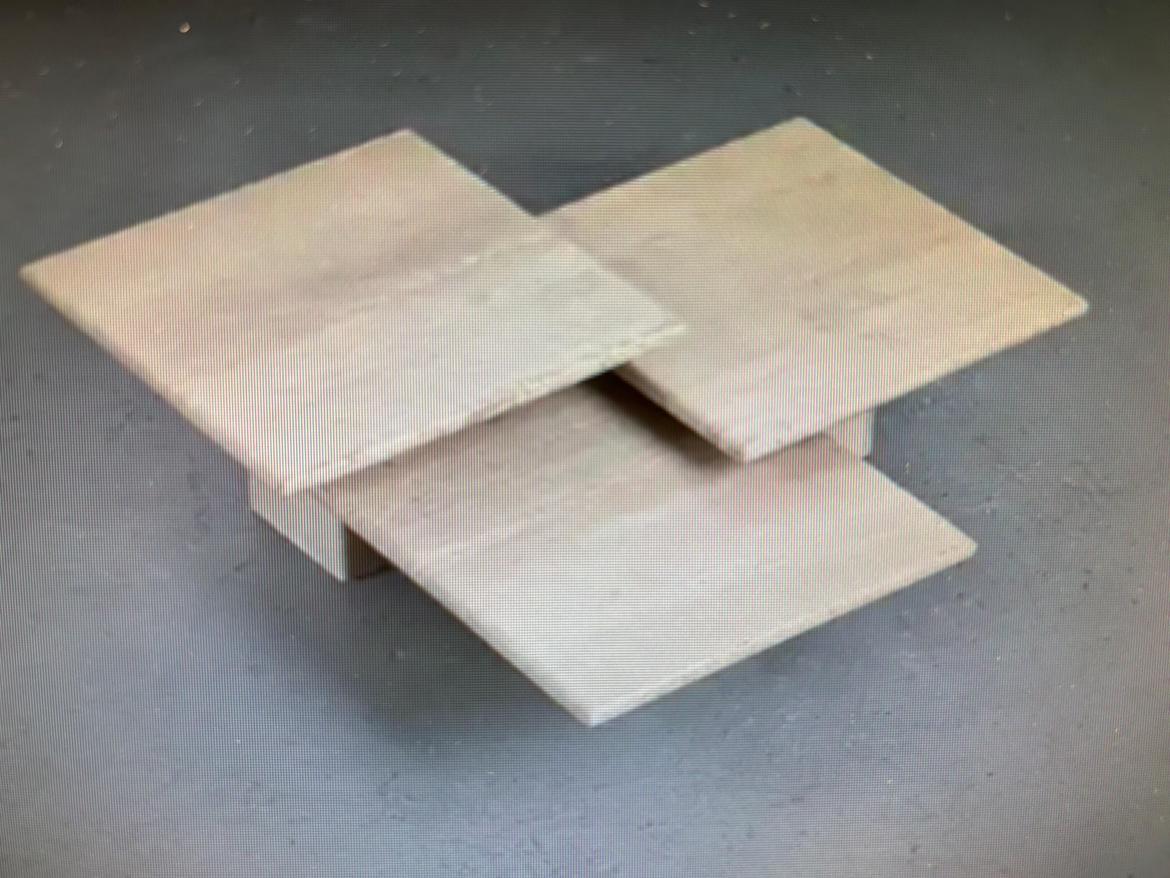 Set Of Three Italian Modern Travertine Tables
Offered is a beautiful set of 3 Italian travertine nesting tables, side tables or coffee tables. This versatile set of travertine tables can be used separately or grouped together to create an