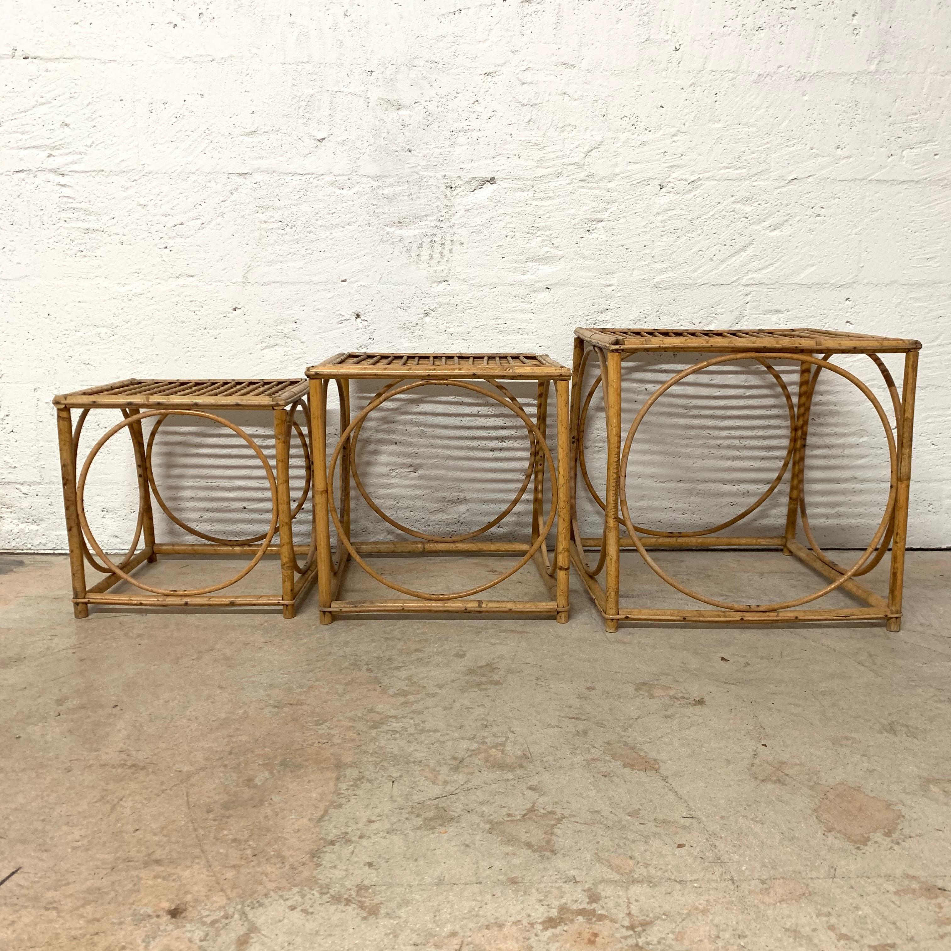Unique set of three nesting or bunching tables in a square stacking cube shape with inset circular design, rendered in rattan, Italian attributed to Franco Albini

Rattan, wicker, bamboo.