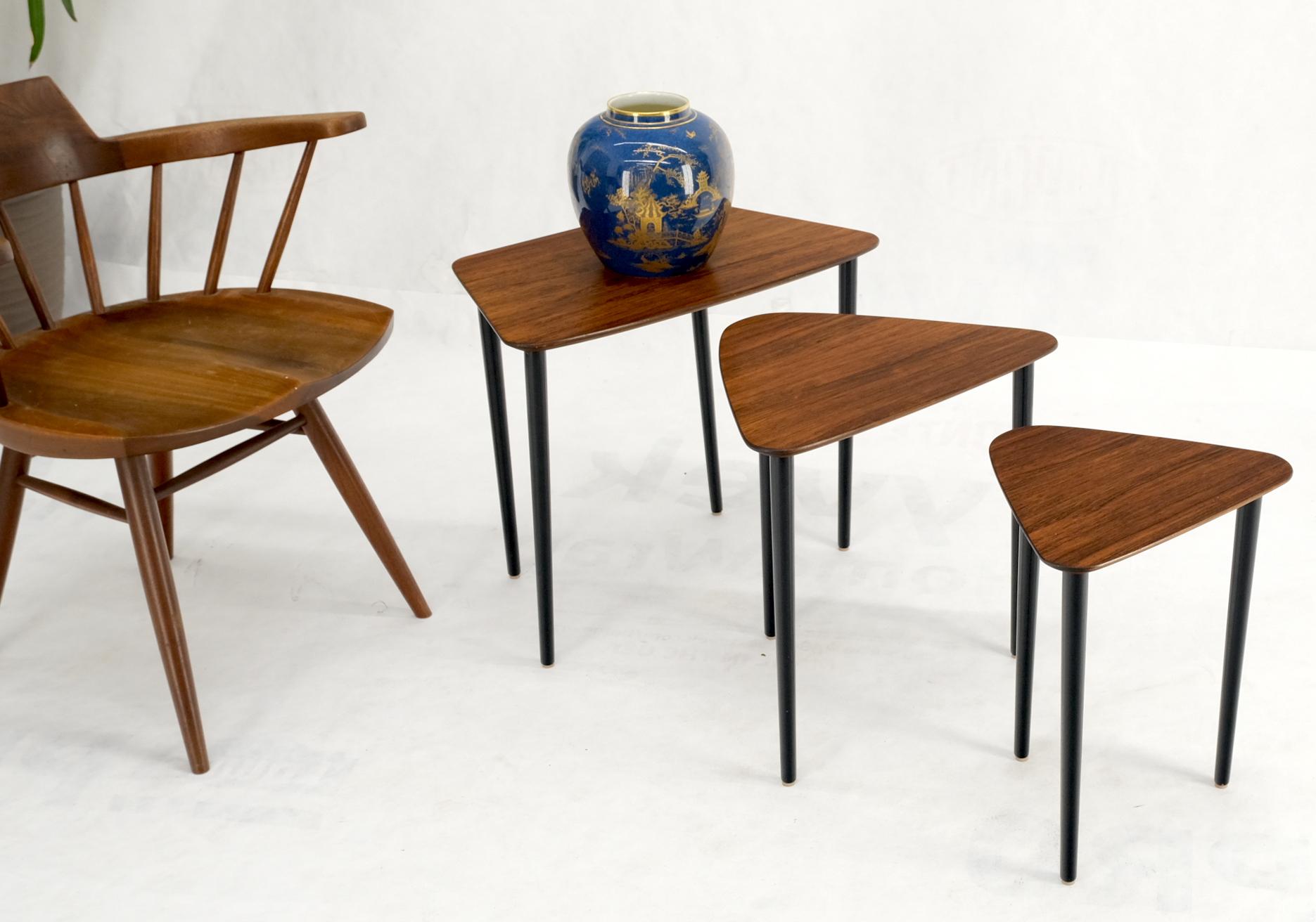 Set of three rosewood mid century Italian modern nesting occasional side end tables on tapered dowel legs.