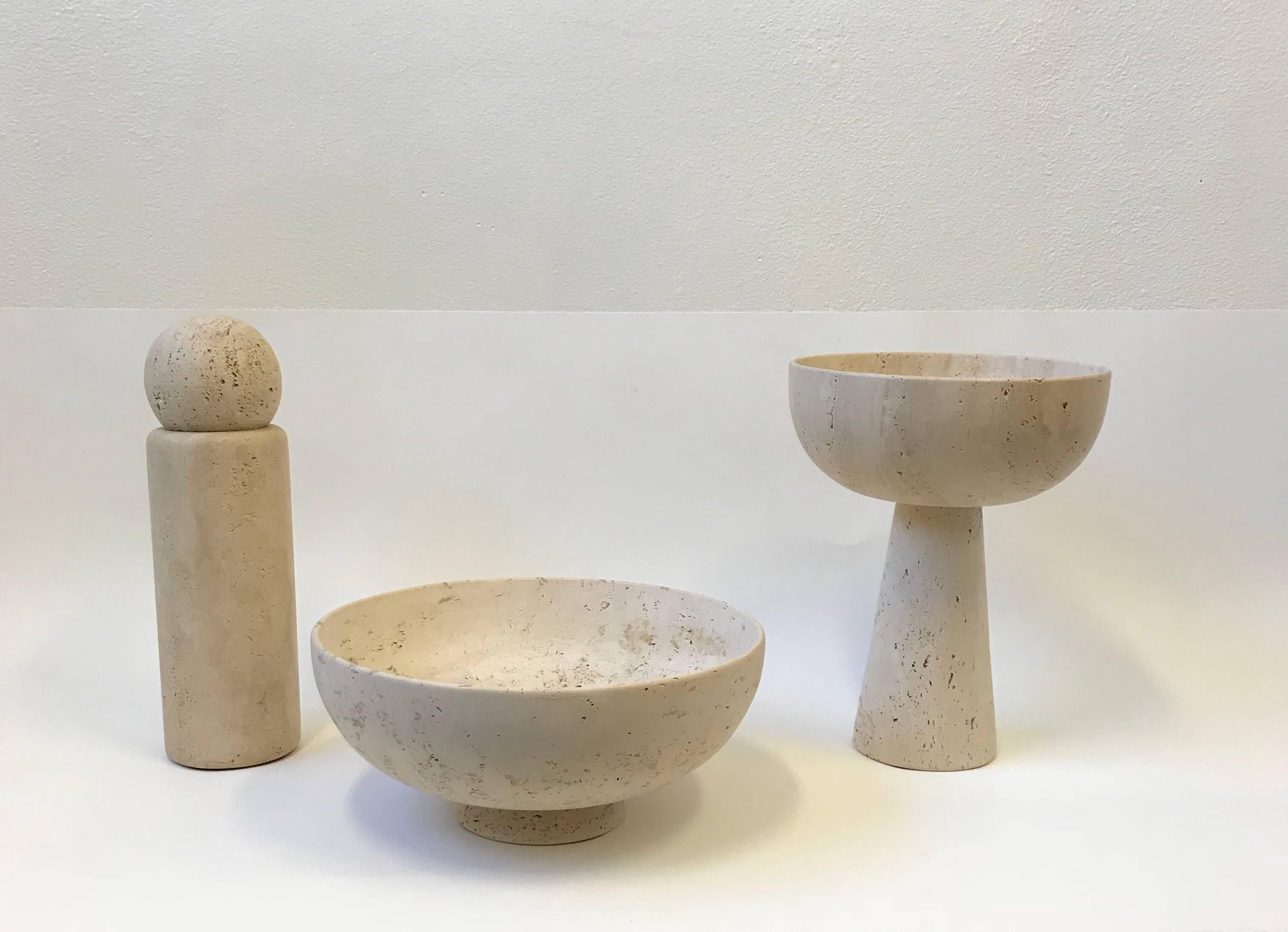 A spectacular 1970s set of three solid raw Italian travertine sculpted Architectural bowls by Raymor. Since they are solid travertine, they are heavy. This can be used indoor or outdoor. 

Dimensions:
Tallest bowl - 17.75” high 13.5”