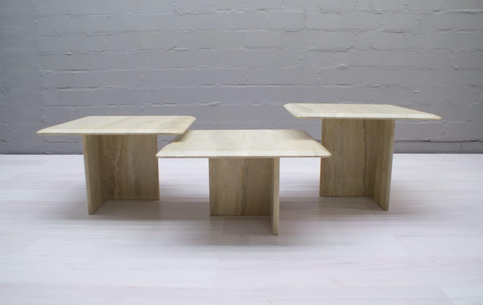 Set of square travertine coffee tables in very good condition.

These coffee tables are made from solid travertine.

They have different heights so they can be combined in many different ways.

Measures: Height 32cm / 12.59