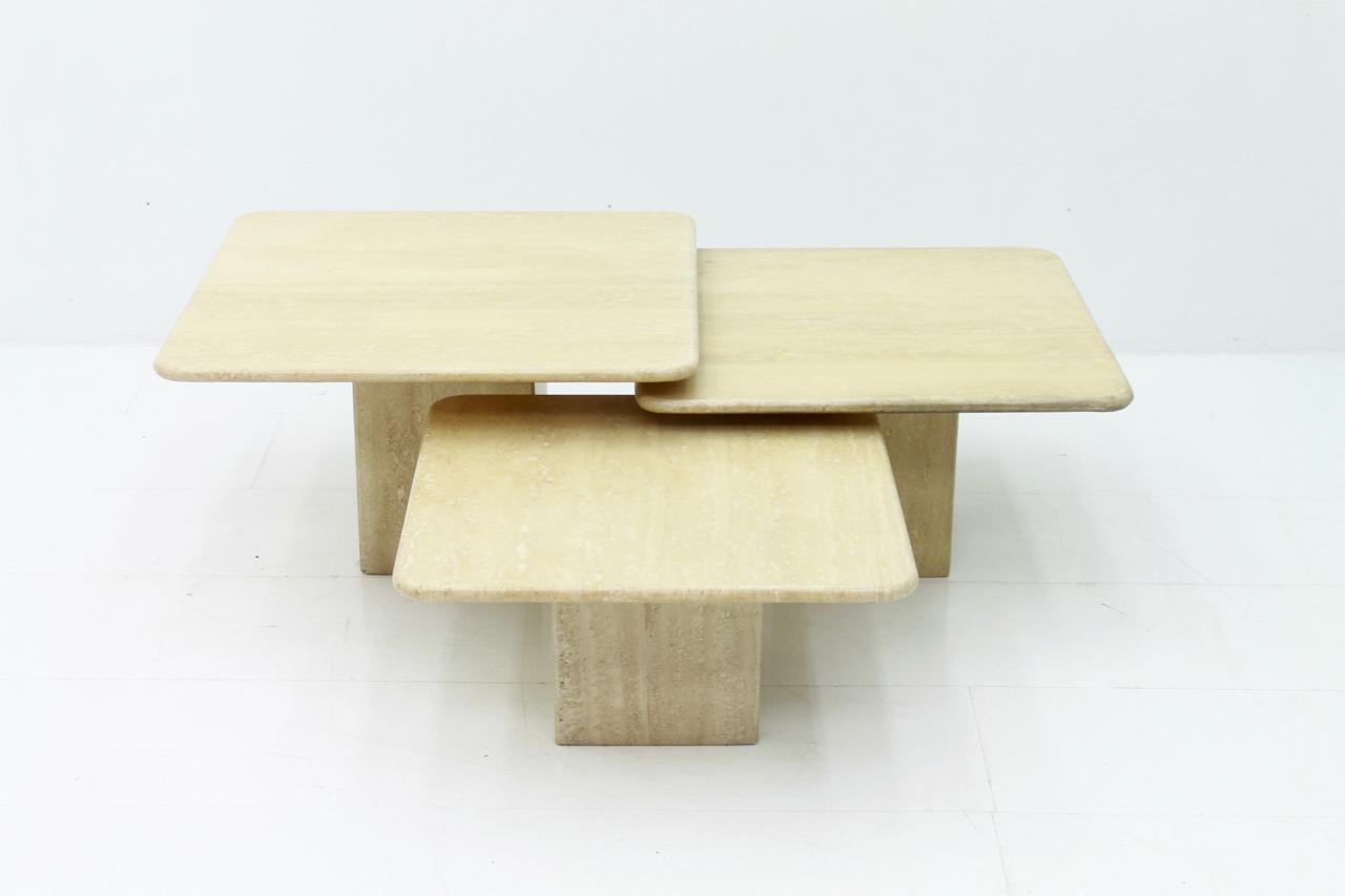 Set of three travertine side or end tables in different size. The travertine top is polished.
Very good condition.

Measurements:

W 60 x D 60 x H 30.5 cm // W 23.6 x D 23.6 x H 12 inch
W 65 x D 65 x H 35 cm // W 26.6 x D 25.6 x H 13.77