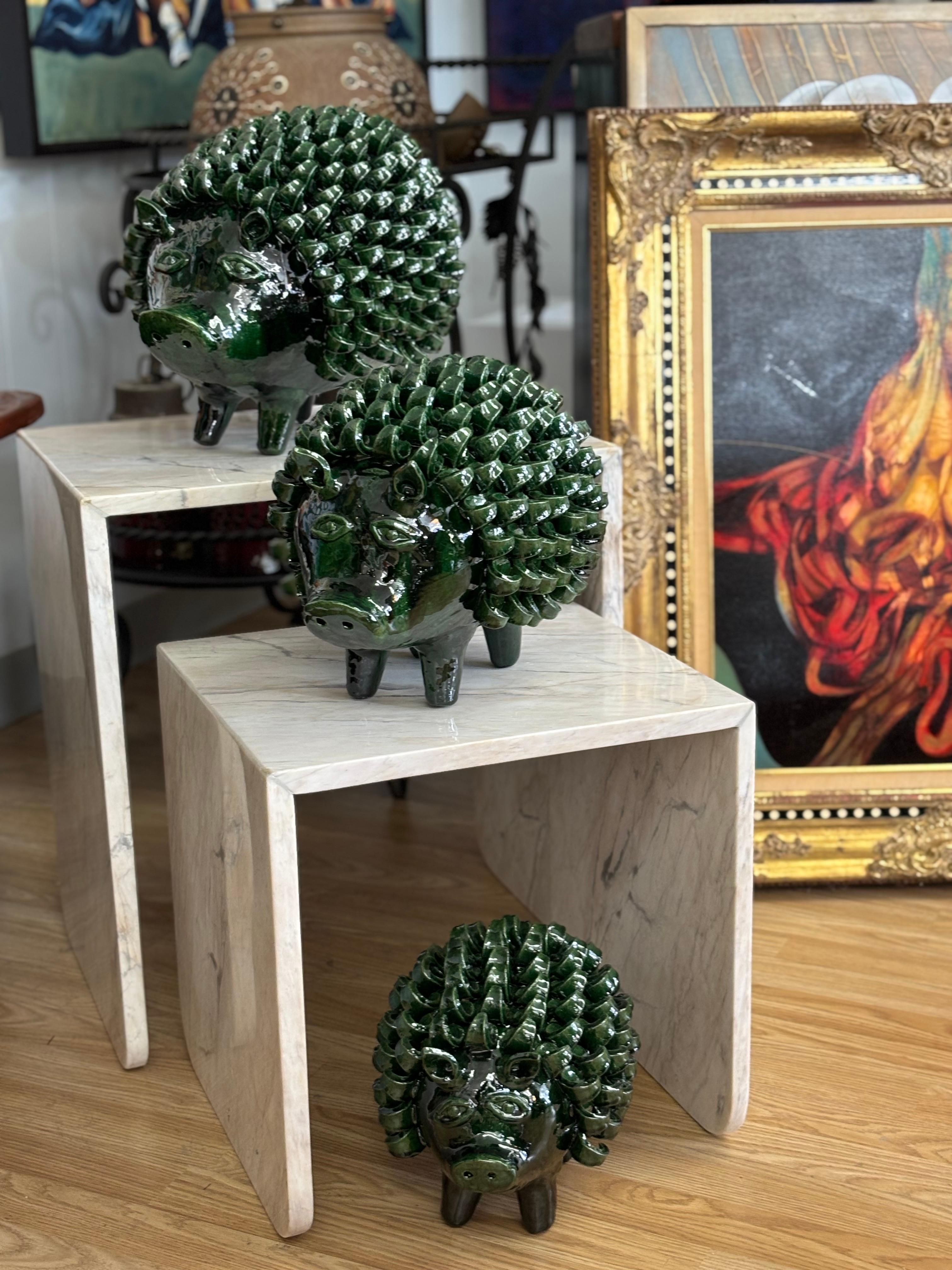 Set of three Mexican graduating hand-molded and glazed Michoacan banks with design referencing javelina (peccaries), circa 21st century, Guanajato, Mexico.

10.5