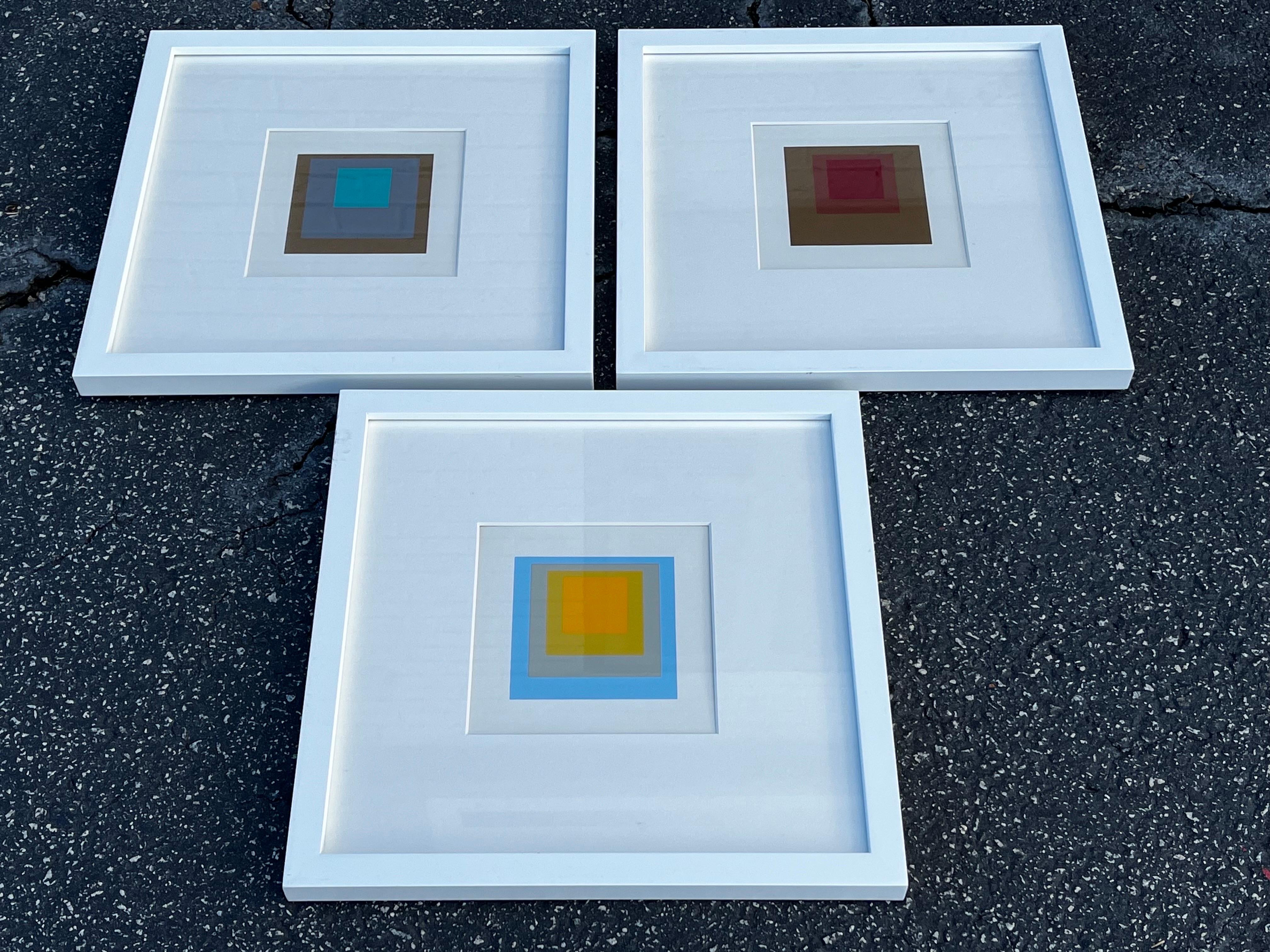 A set of three vintage circa 1965 mid 20th Century hard edge geometric silkscreen serigraph prints from the Homage to the Square by Joseph Albers. These prints were part of promotional materials sent to prospective clients to purchase the book. The