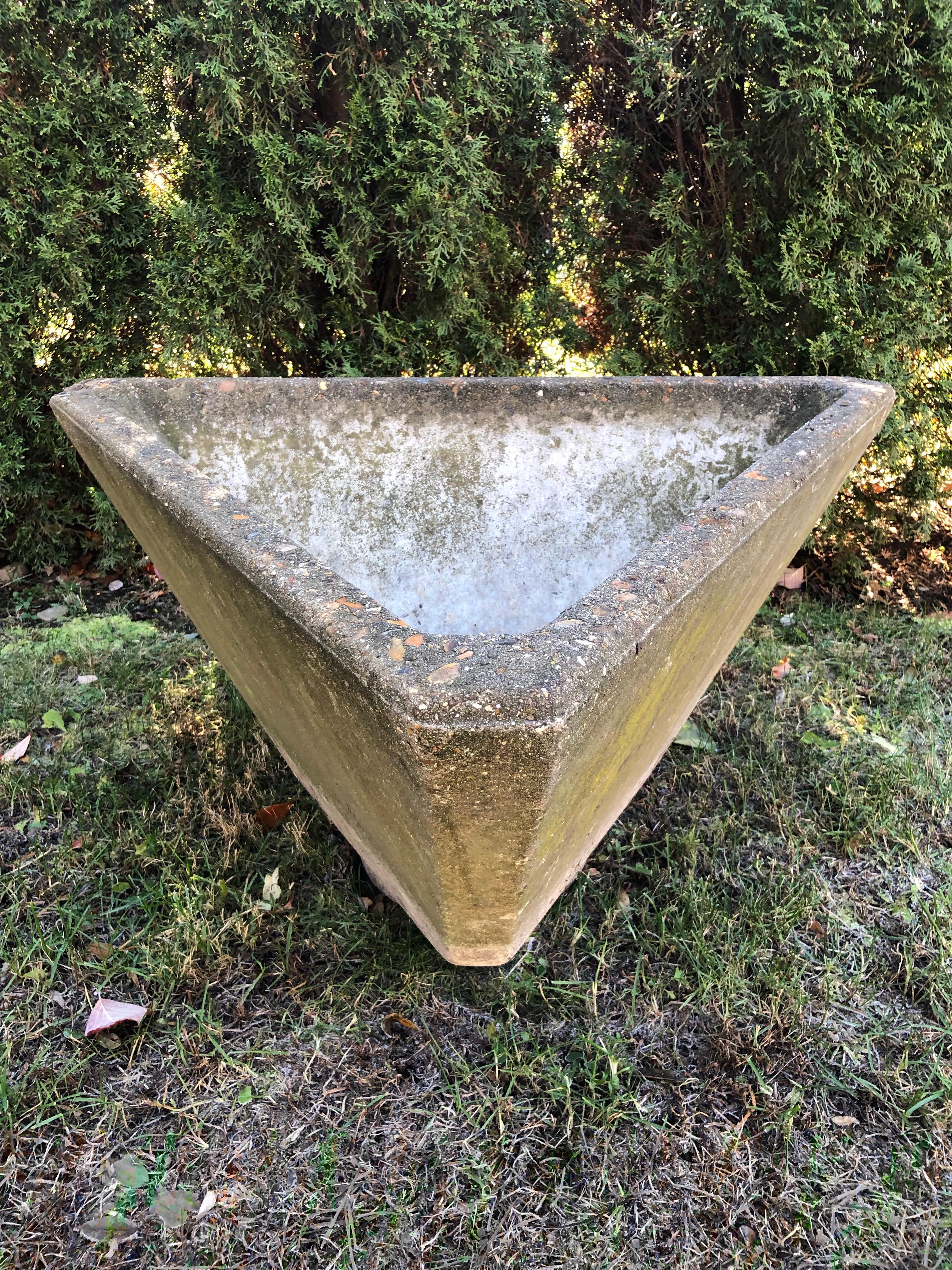 We love unusual forms in the garden and these very large and heavy triangular planters do not disappoint. In very good vintage condition with a beautifully- weathered and greening patina (the beginning of moss), they will develop a mossy surface
