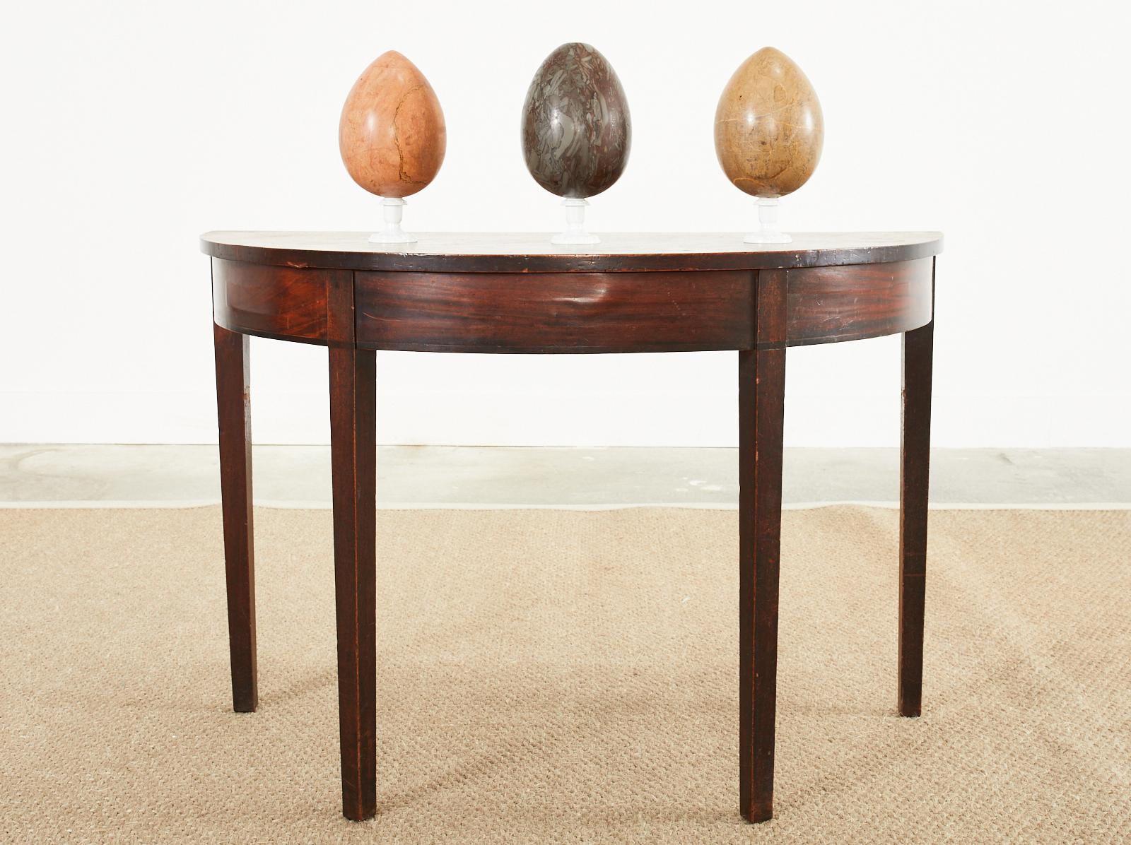 Unique set of three large Italian polished marble egg specimens from Italy. Beautifully hand-formed and each having a slightly different color. The exquisite polishing showcases the interesting marble veins. Price is for the set of three. We have