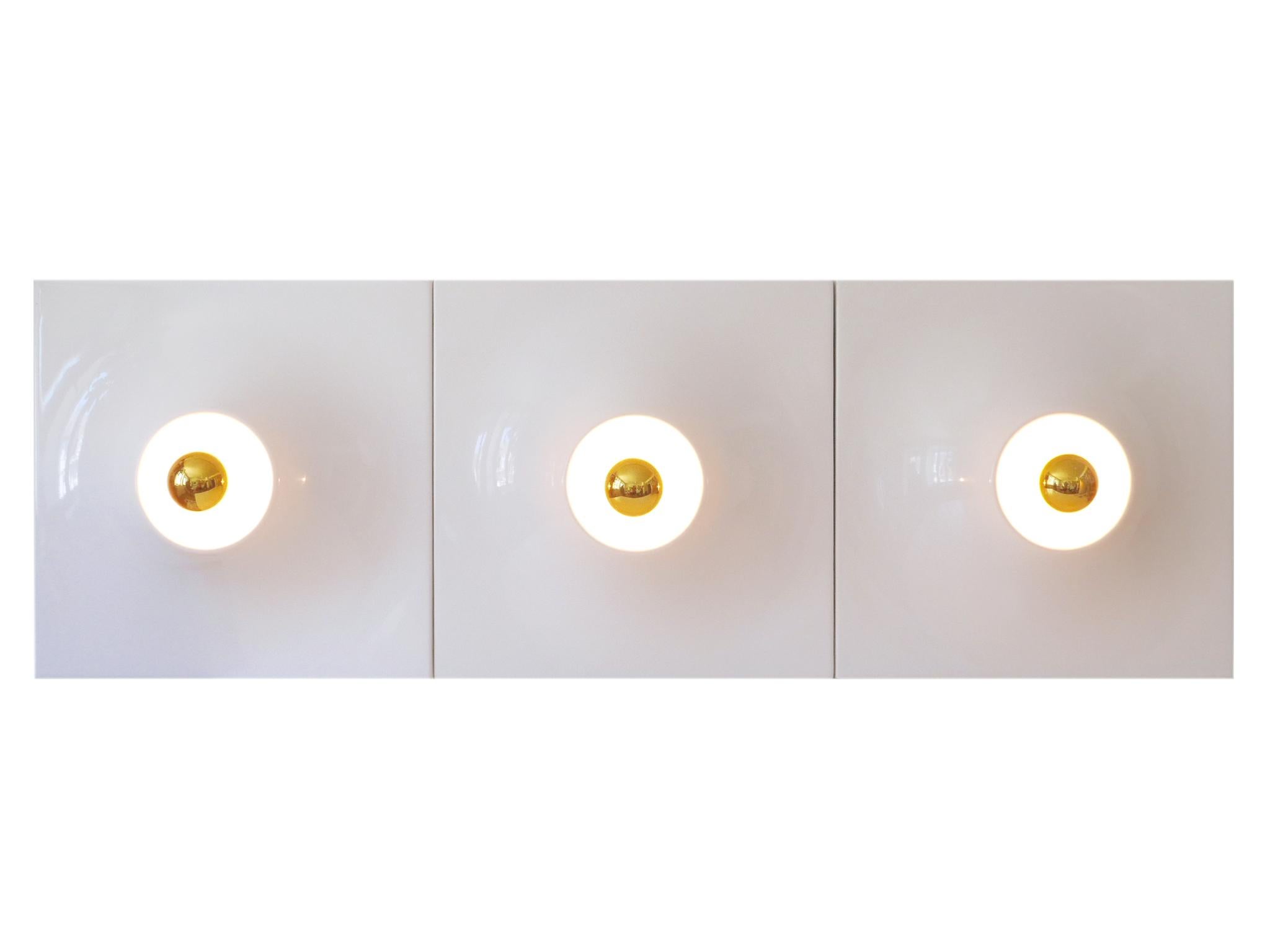 Set of three large and highly decorative Mid-Century Modern fiberglass wall panel lights or sconces. Designed & manufactured in Germany, 1970s.

Executed in white plastic coated fiberglass, each fixture is executed with 1 x E27 / E26 Edison screw