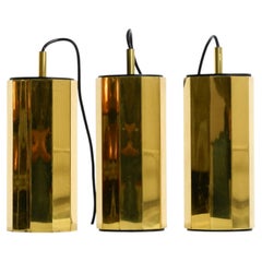 Ensemble de trois grandes lampes suspendues décagonales en laiton, originales des années 1960