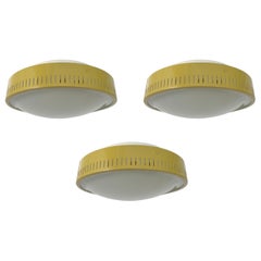 Set of three large Stilnovo mustard-colored flush mounts