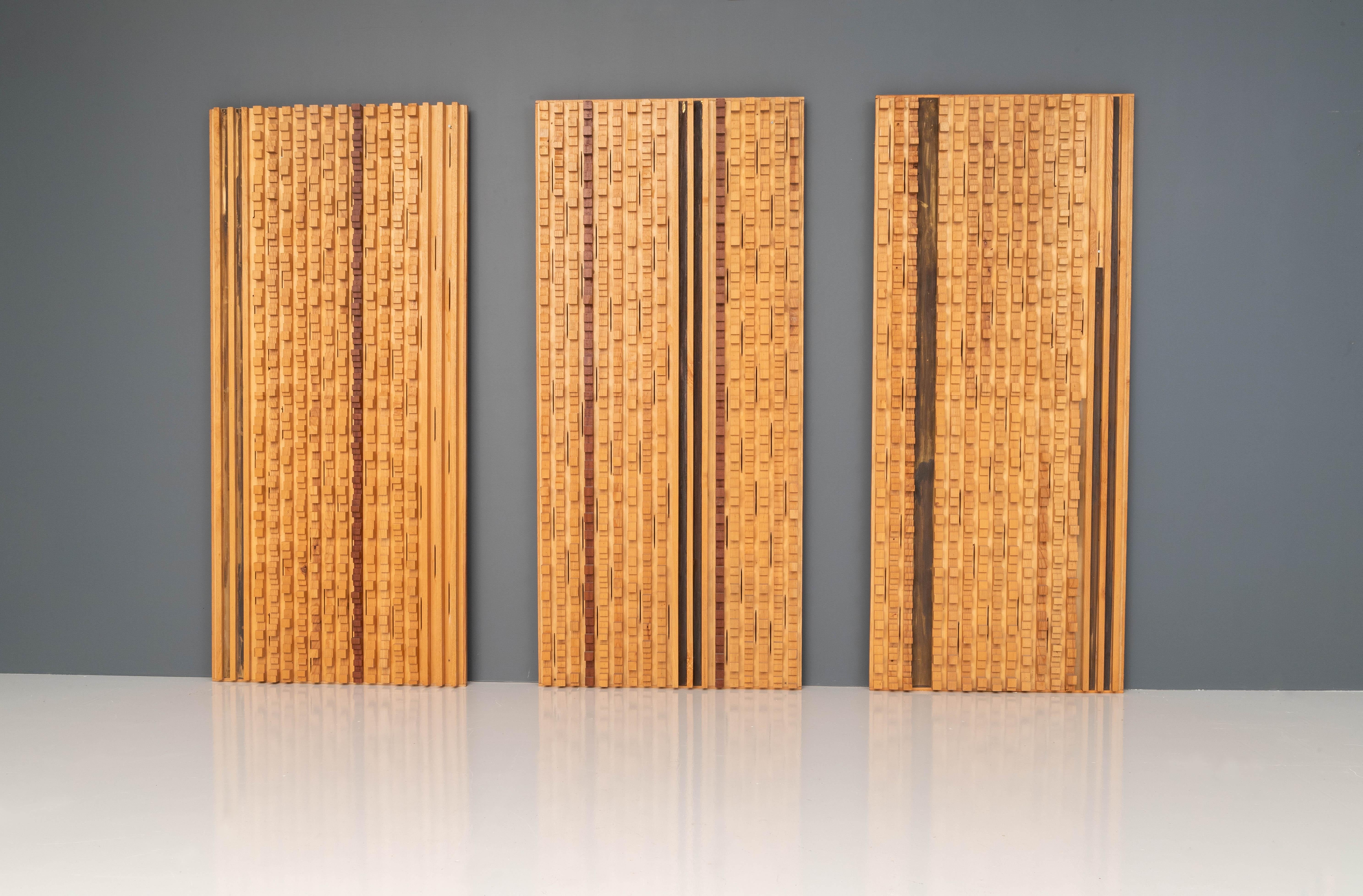 Set of 3 large wall panels by Italian sculptor Stefano d'Amico (varying in width from 86 to 92 cm.) in ash and brass designed and dated, 1974.

There is not so much known about D'Amico's work apart from that he held expositions in Milan and Genova