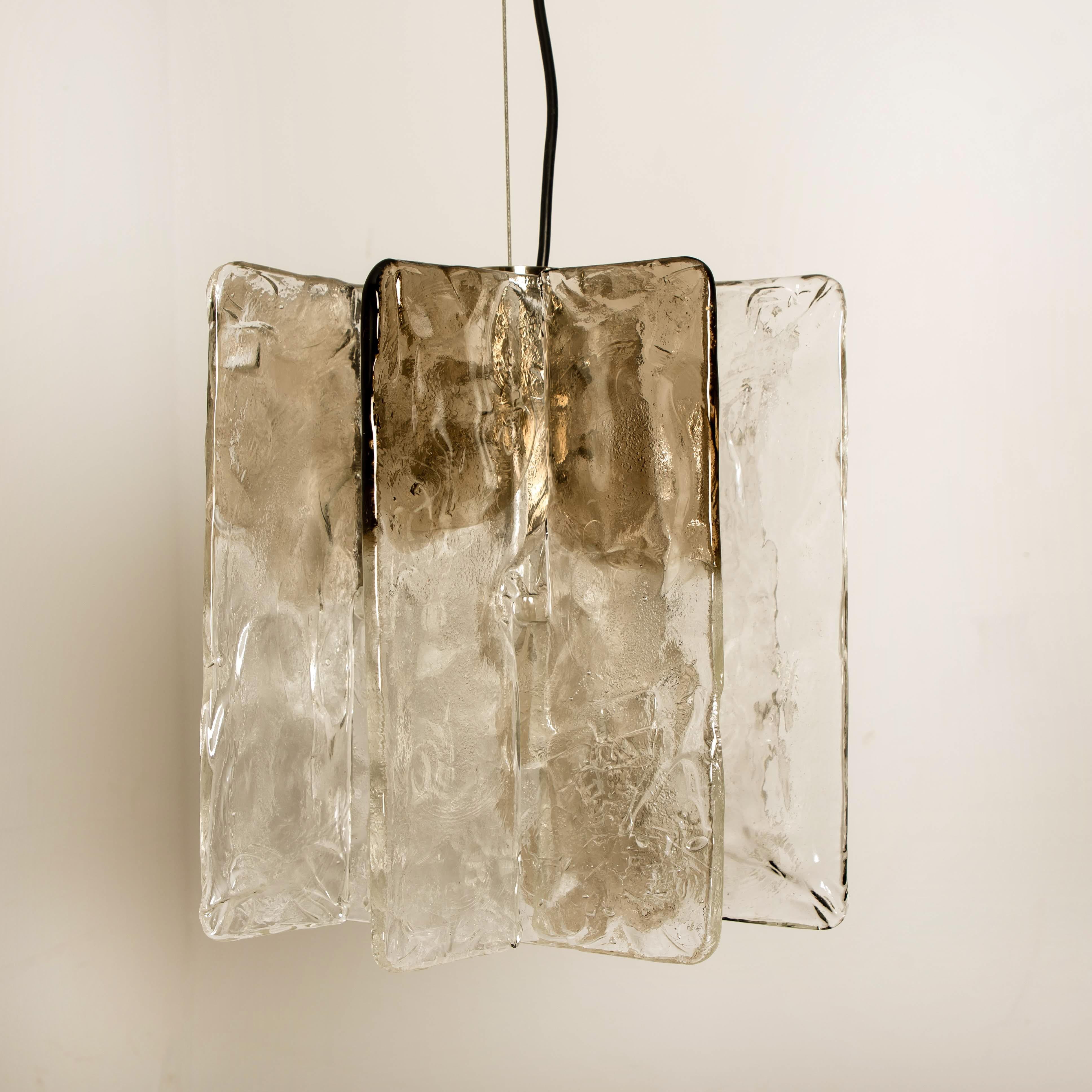 Set of three-light fixtures by Carlo Nason for Mazzega, 1970s. Each light consists of four 0.5 cm thick glass plates in clear and smoked glass, which are mounted on a nickel-plated base. Each lamp has an E27 socket (max 80 Watt).

Please notice