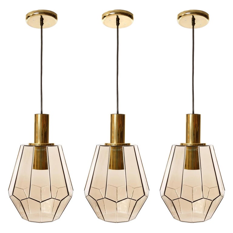 Set of Three Limburg Pendant Lights, Brass and Amber Smoked Glass, 1970s For Sale