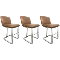 Set of Three Lion in Frost Lucite and Leather Swivel Bar or Counter Stools