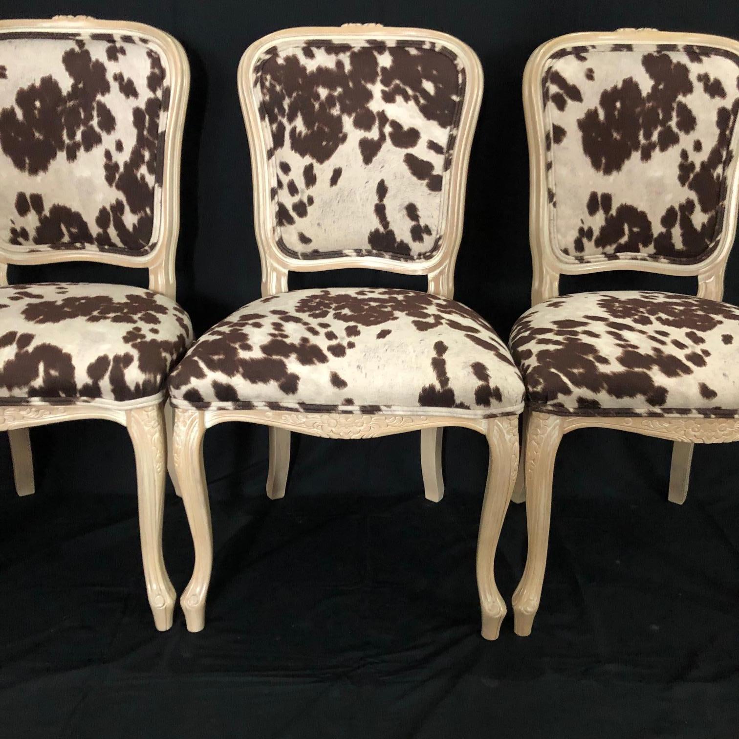 Stylish spin on classic set of 3 petite Louis XV style bleached carved wood chairs having chic high end faux hide upholstery with double piping detail. Measure: Seat height 19.
 #5115.