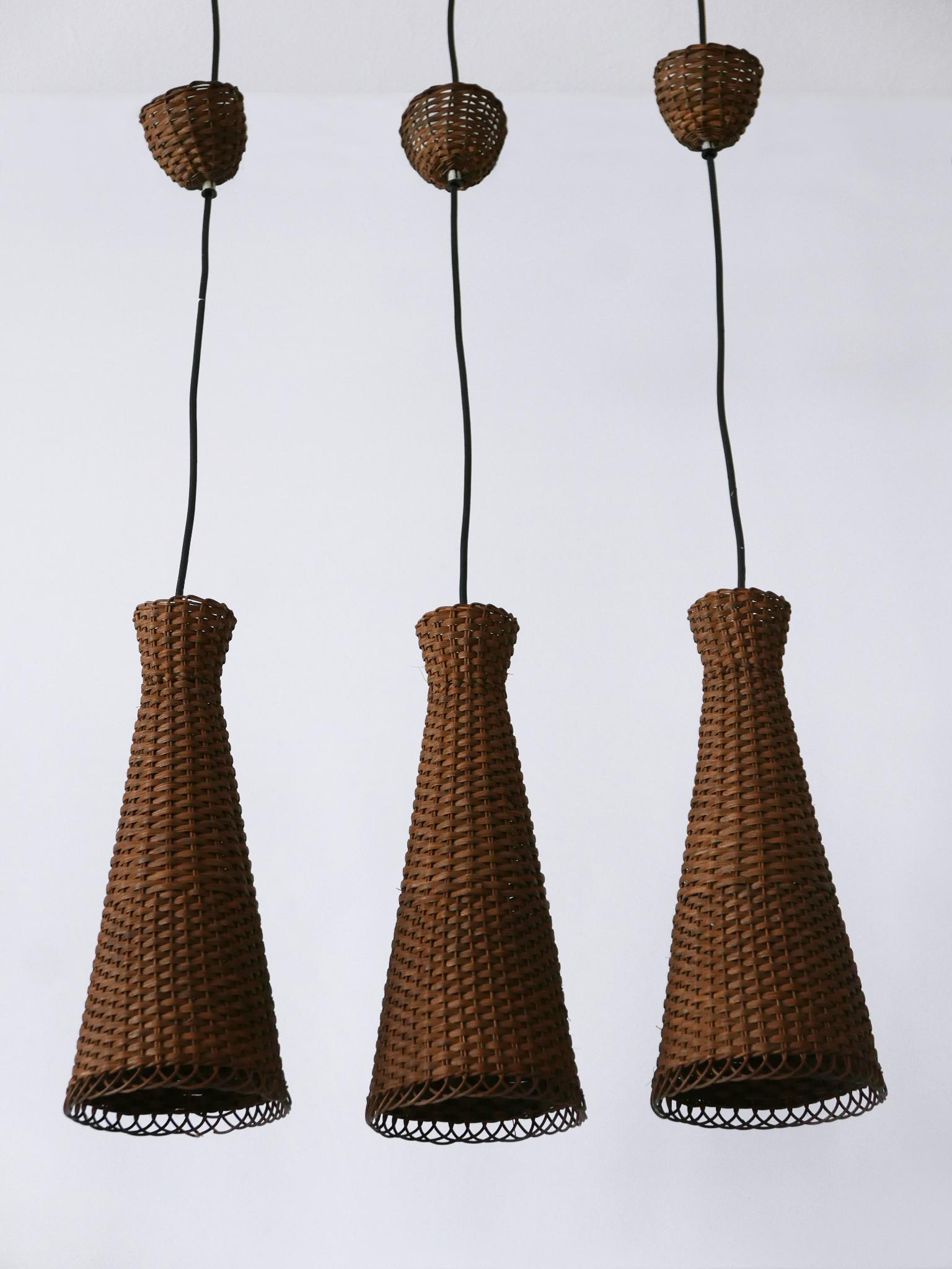 Satz von drei schönen modernen Rattan-Diabolo-Hängeleuchten aus der Jahrhundertmitte 1960er Jahre im Angebot 1