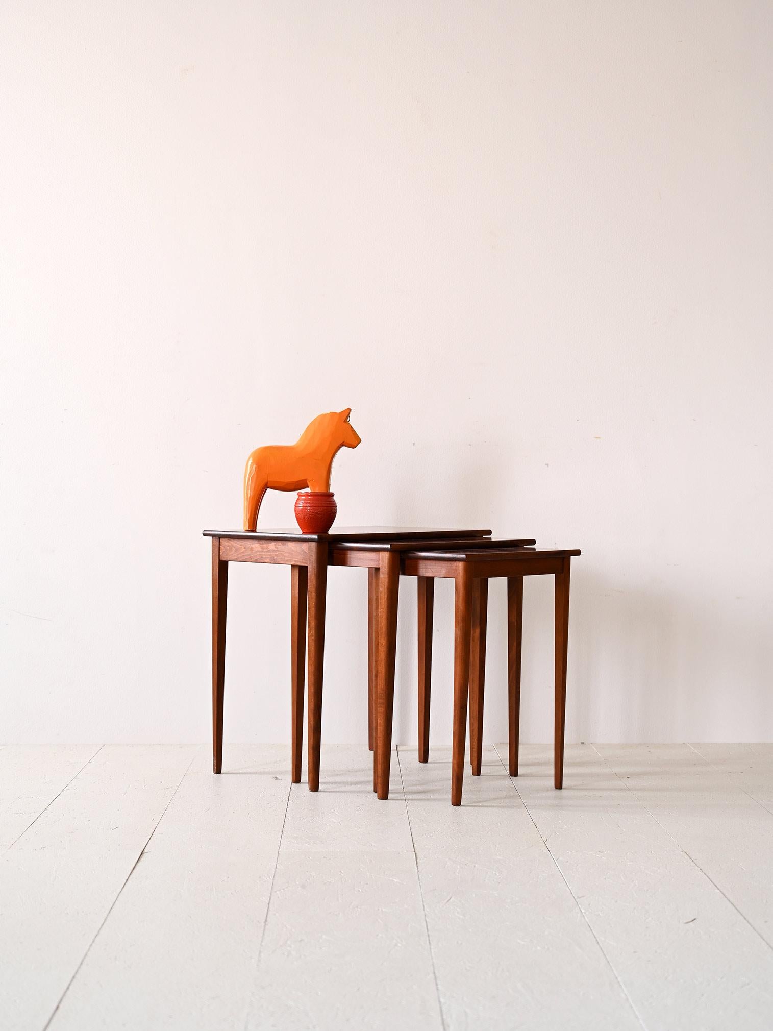 Vintage Scandinavian side tables.

These three coffee tables of different sizes are ideal for those who have limited space in their homes but do not want to give up a large, practical and visually pleasing table top.
Consisting of a simple