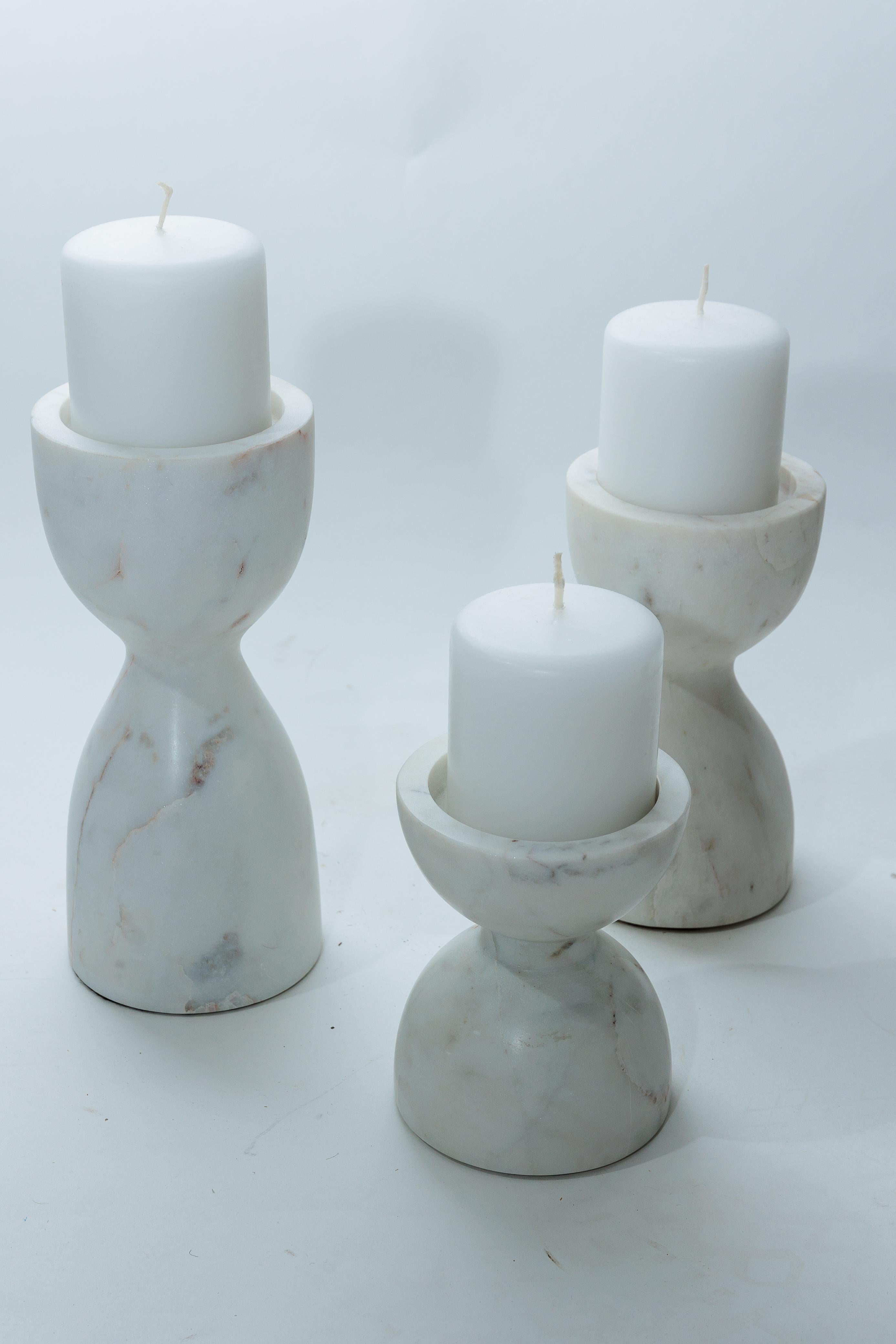 The set is of three marble candle holders. Heights: 5.5