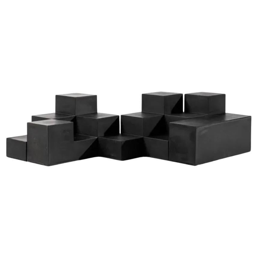 Italian architect Mario Bellini is well known for creating powerful, thoughtful and creative pieces of design. The Gli Chess series works both as modular tables or seating. The versitility in interconnectivity between the differing forms places