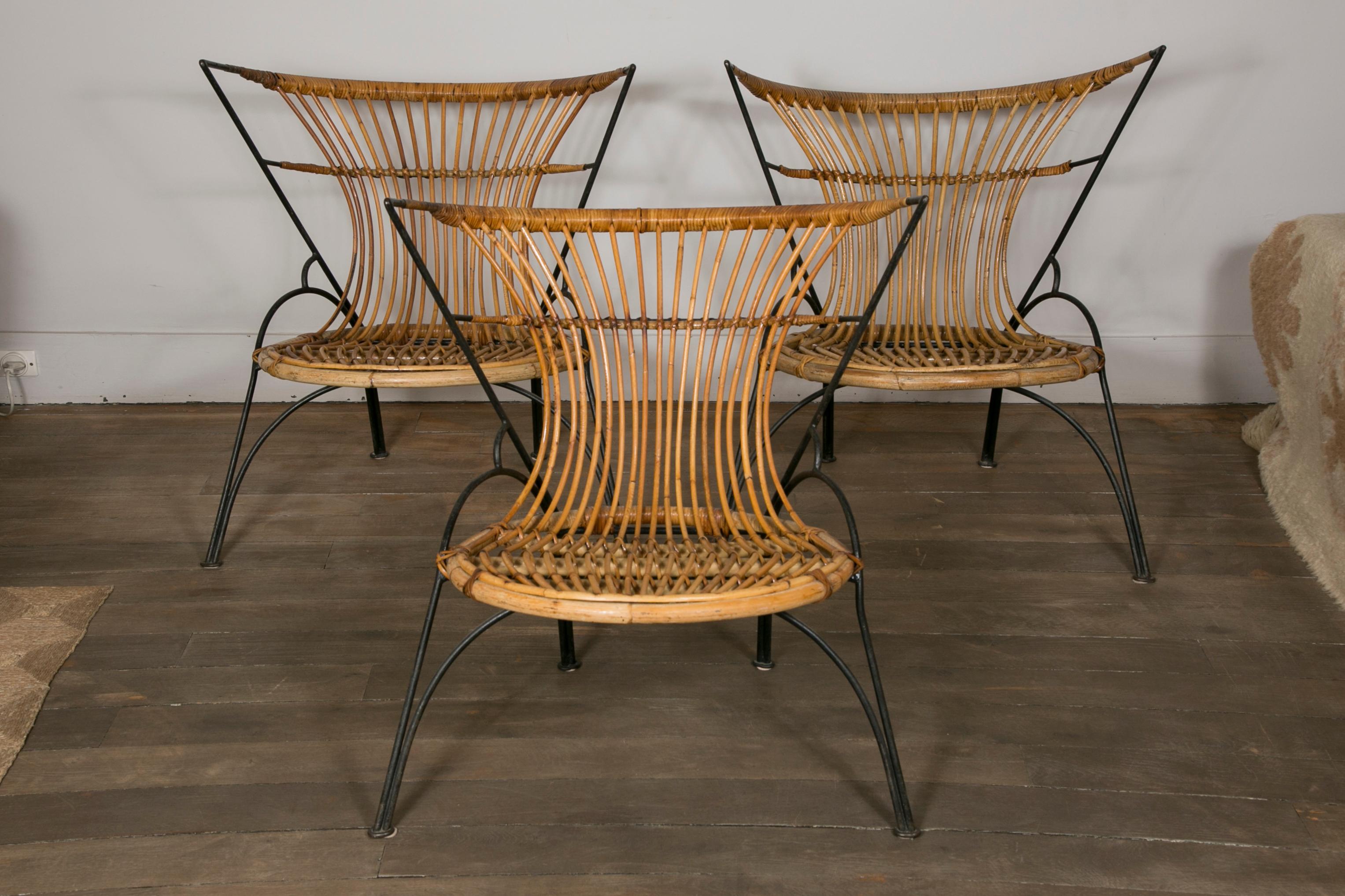 Black lacquered metal structure and woven wicker. 
France, circa 1950.

Measures: Height 29.52 in. (75 cm)
Width 25.98 in. (66 cm)
Depth 25.19 in. (64 cm) 
Height seat 14.96 in. (38 cm).
 
 