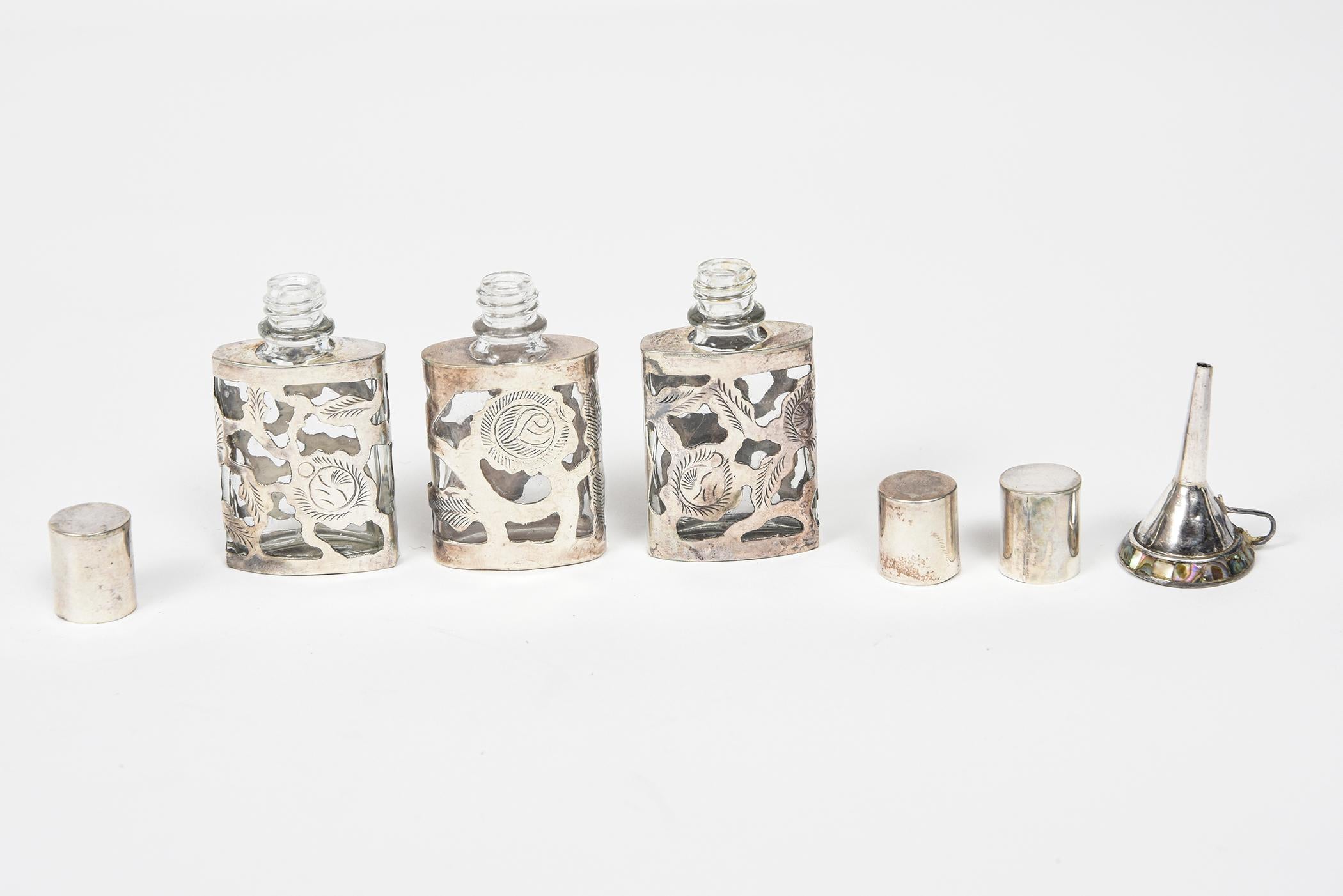 20th Century Set of Three Mexican Floral Sterling Silver Overlay Perfume Bottles with Funnel For Sale