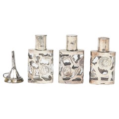 Set of Three Mexican Floral Sterling Silver Overlay Perfume Bottles with Funnel