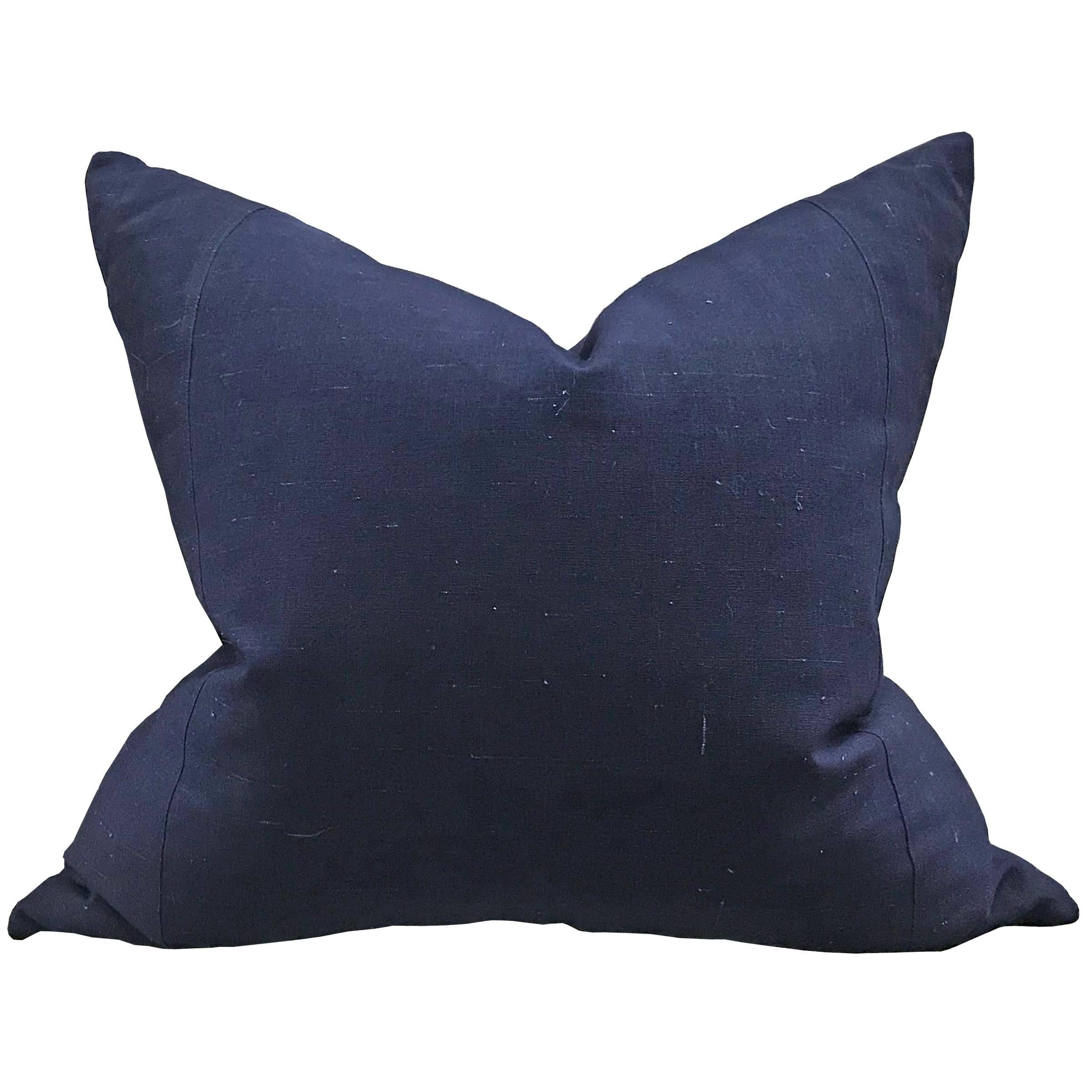 Set of three pillows made from mid-20th century Chinese indigo cotton panels with natural slubs, and filled with down.