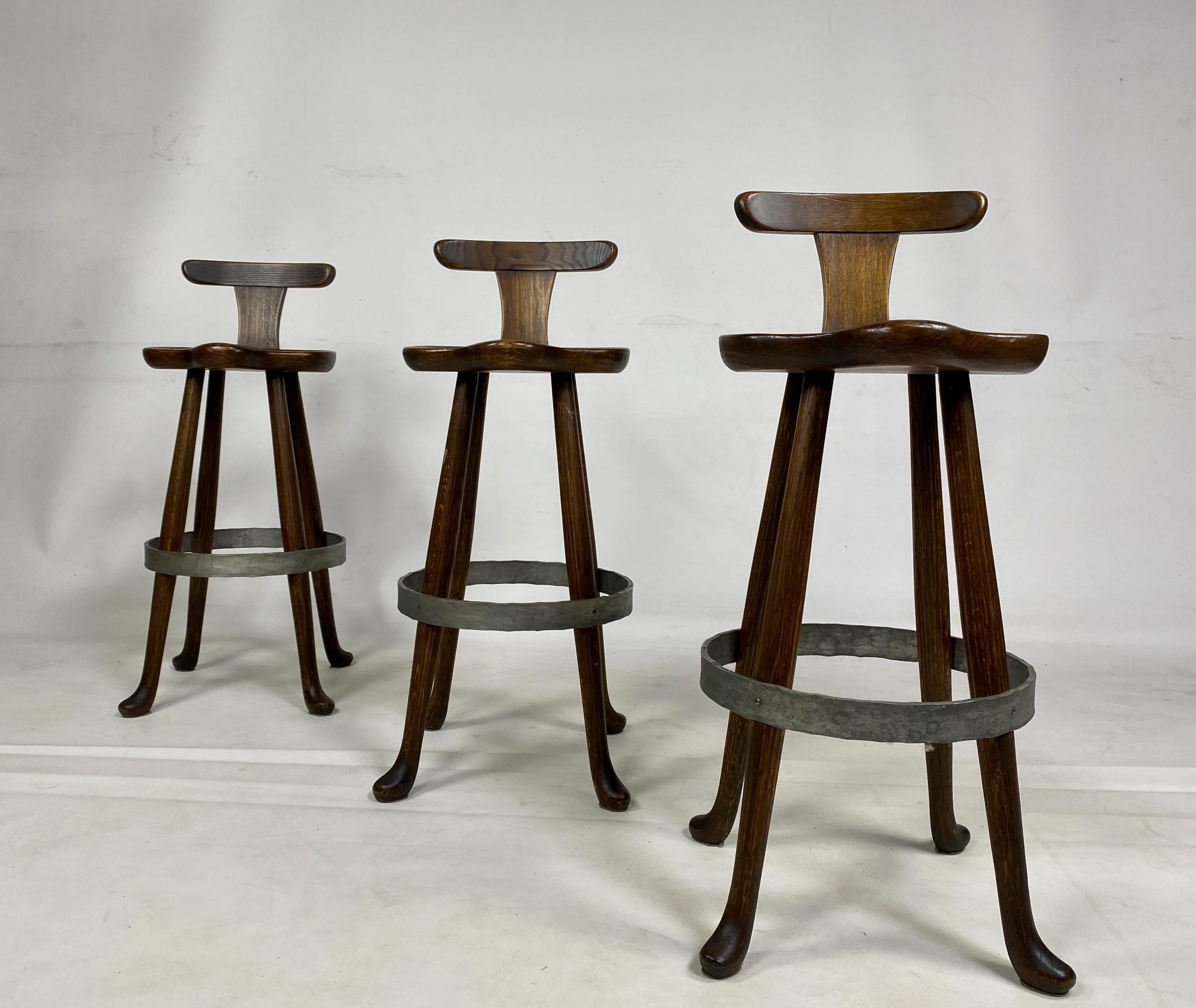 Set of three stools

Oak

Iron foot supporting ring

Adzed seat

Pad feet

France 1960s

Seat height 80cm.