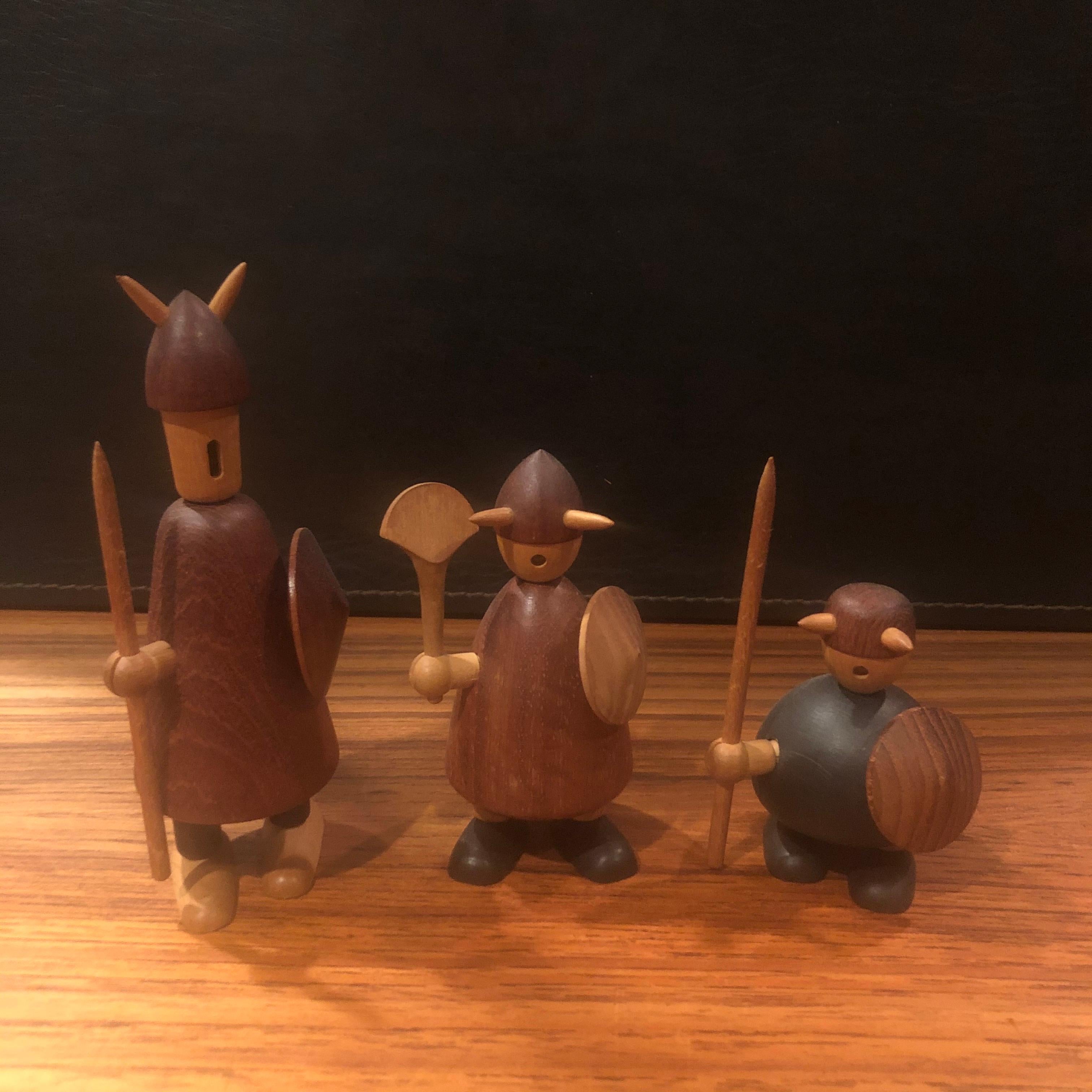 Set of three midcentury Danish Viking figures made of mixed woods by Jacob Jensen, circa 1950s. The figures are in good vintage condition and measure: 5.5