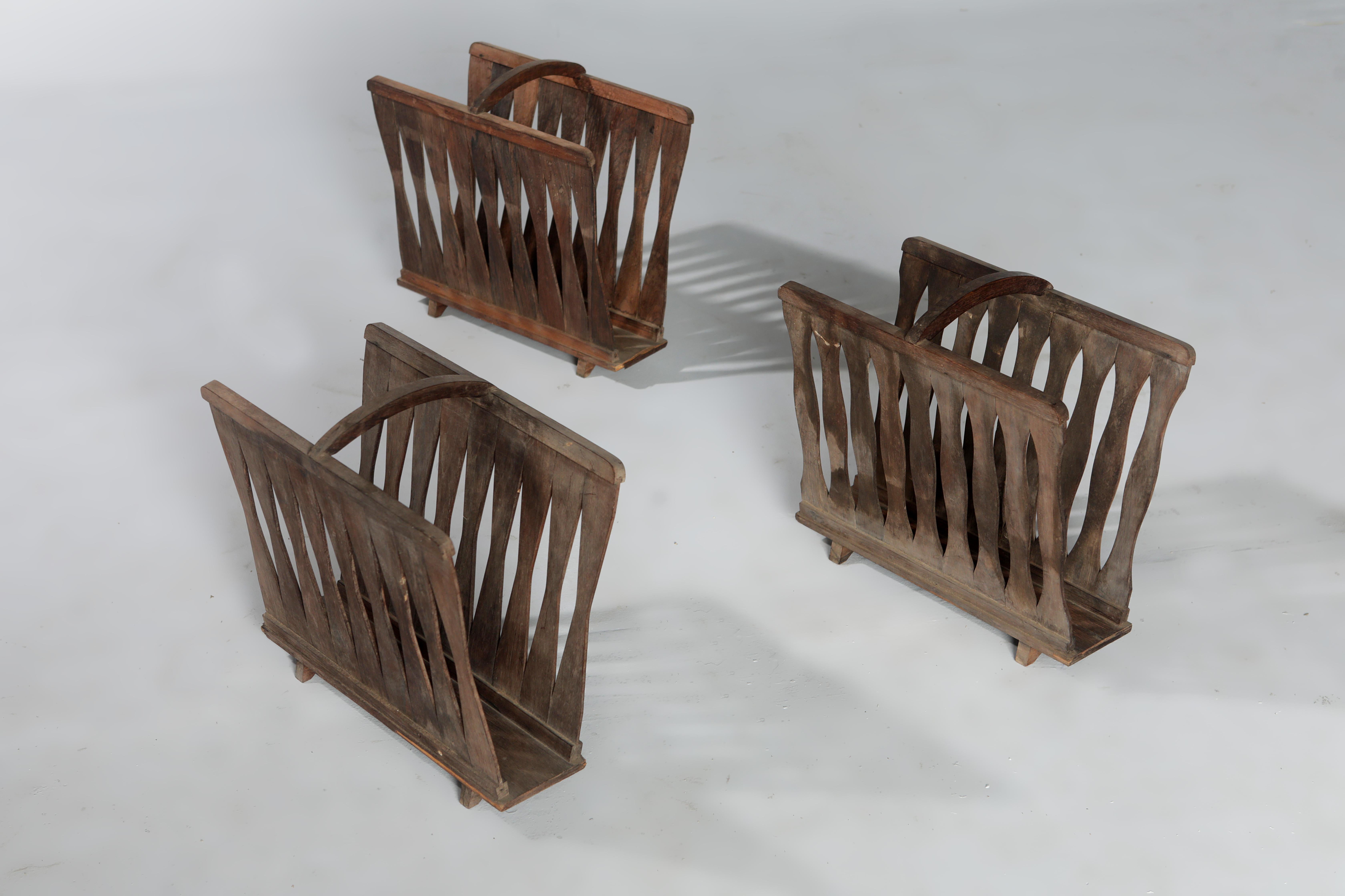 Set of three Mid-Century Modern wooden magazine racks by Brazilian Designer, 1950s.

Made of solid wood and finished with varnish, this piece is part of a set of magazine racks and other pieces by unknown Brazilian artists from the 50's.