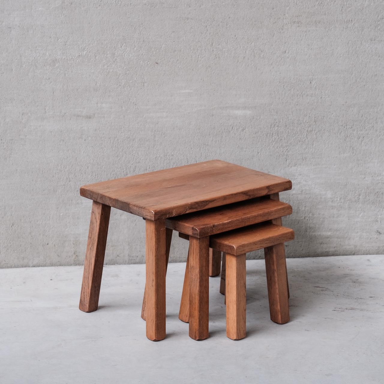 A set of three nesting tables.

Belgium, c1970s.

Simple strong sharp lines. Functional as a nesting set or used around the room separately.

Oak.

Good vintage condition.

Dimensions taken for the tallest table.

Internal Reference:
