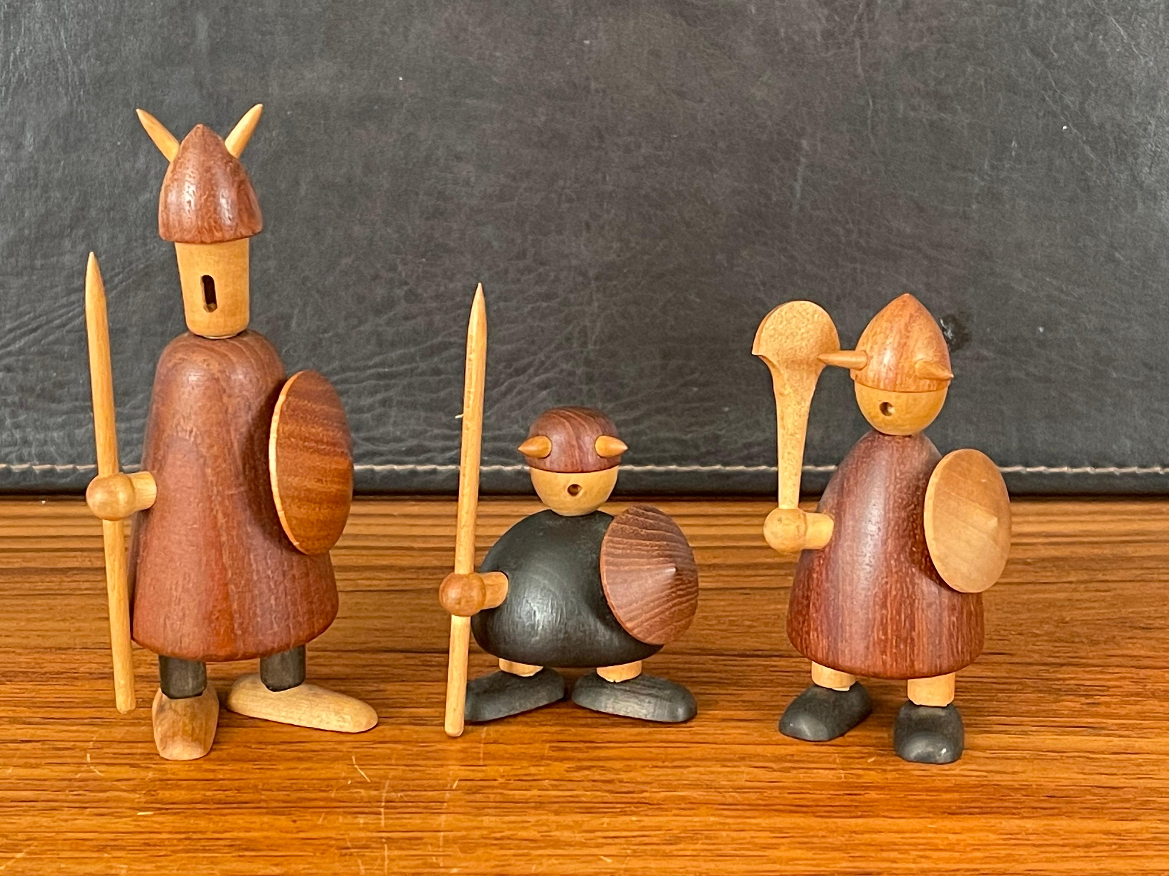 Set of three midcentury Danish Viking figures made of mixed woods by Jacob Jensen, circa 1950s. The figures are in good vintage condition and measure: 5.5