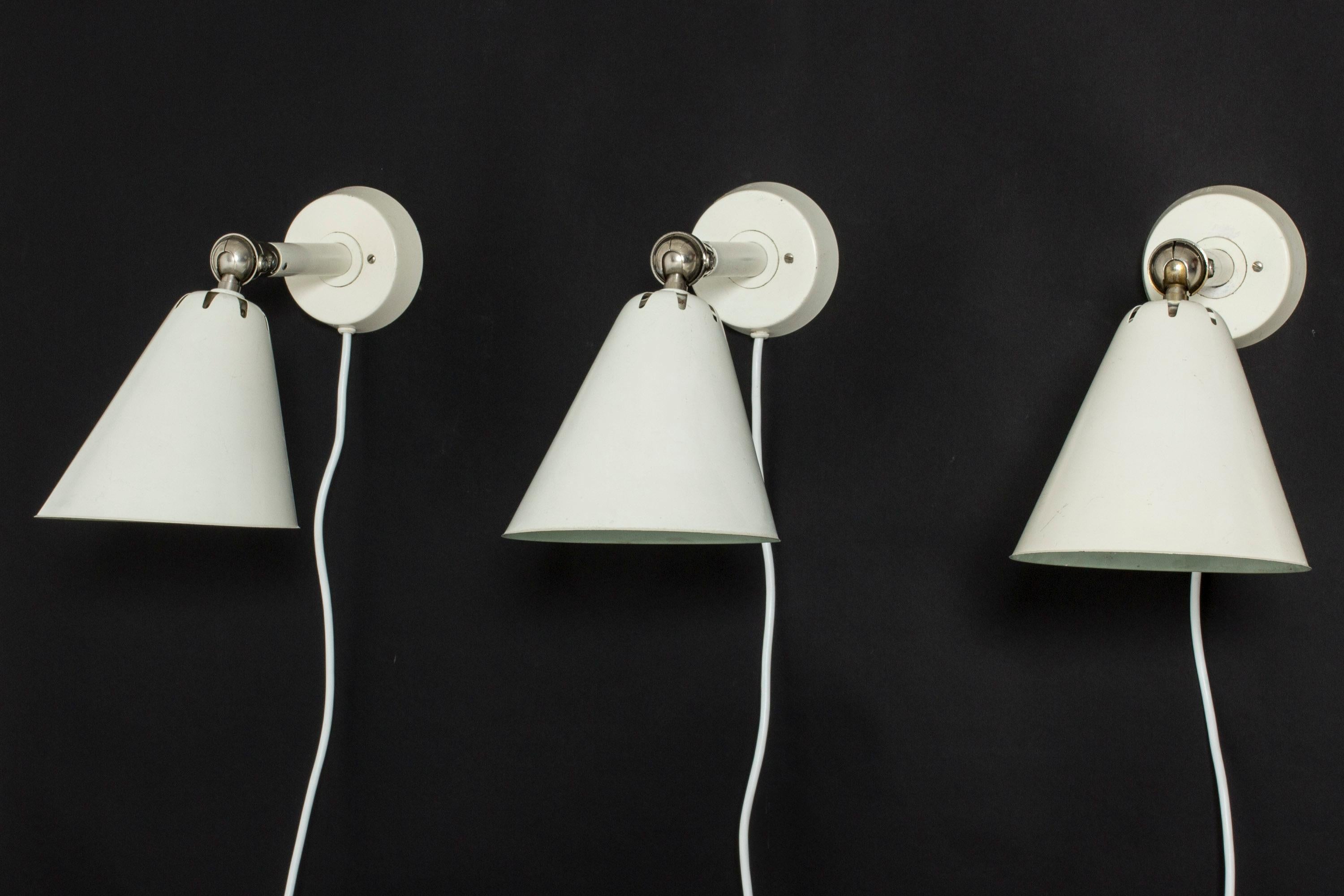 Set of three very cool wall lights from ASEA, made from metal with white lacquer. Industrial look with accentuated joinery on the necks.