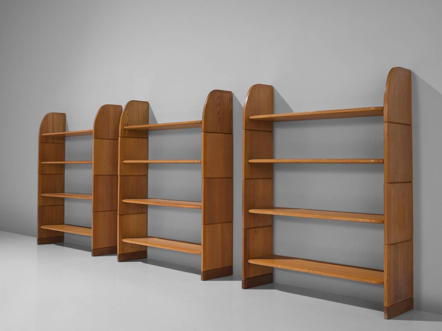 Arthur Milani, bookshelves, solid pine, Swiss, 1947.

This set of three solid pine bookcases have a nice simplified yet elegant design. The pine planks on each side become smaller towards the top giving the shelves a less geometric feel. Each unit