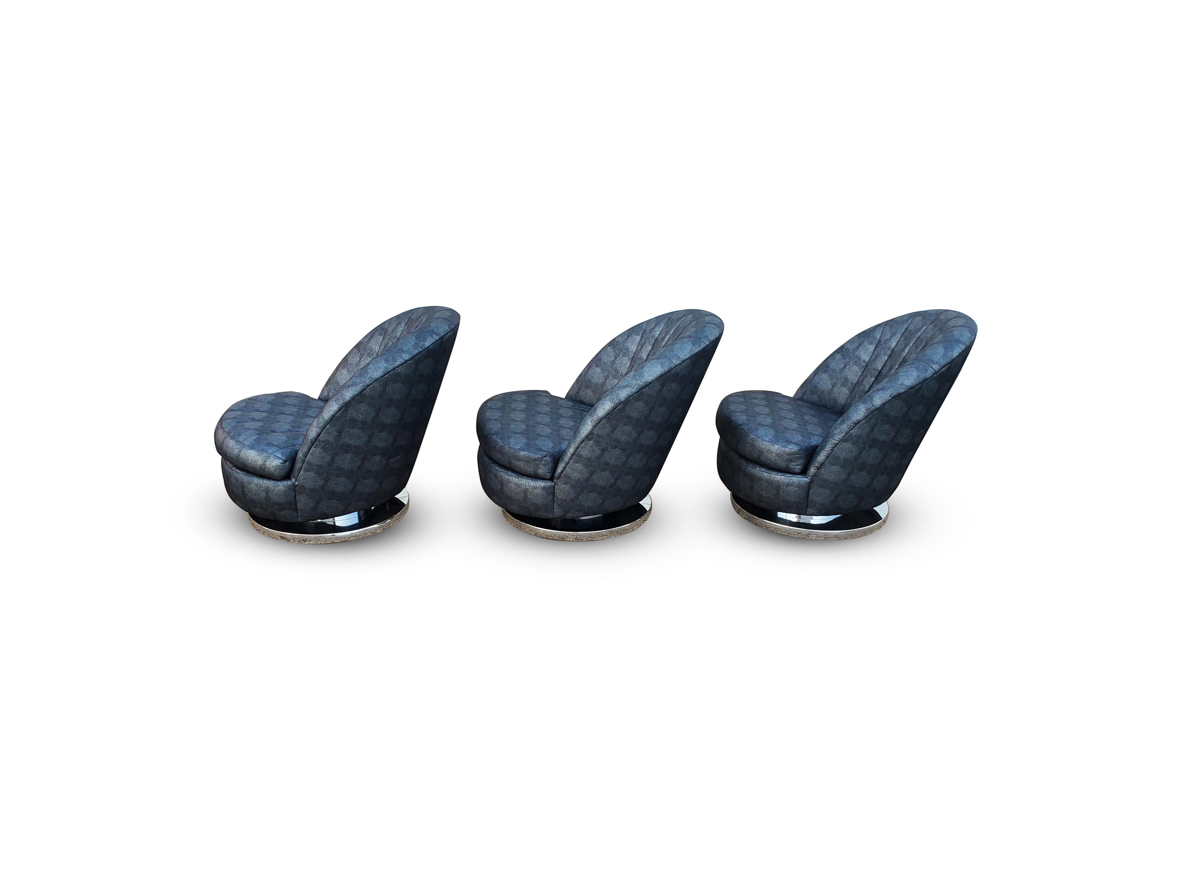 Set of three Milo Baughman tilt and swivel lounge chairs chrome bases.

   