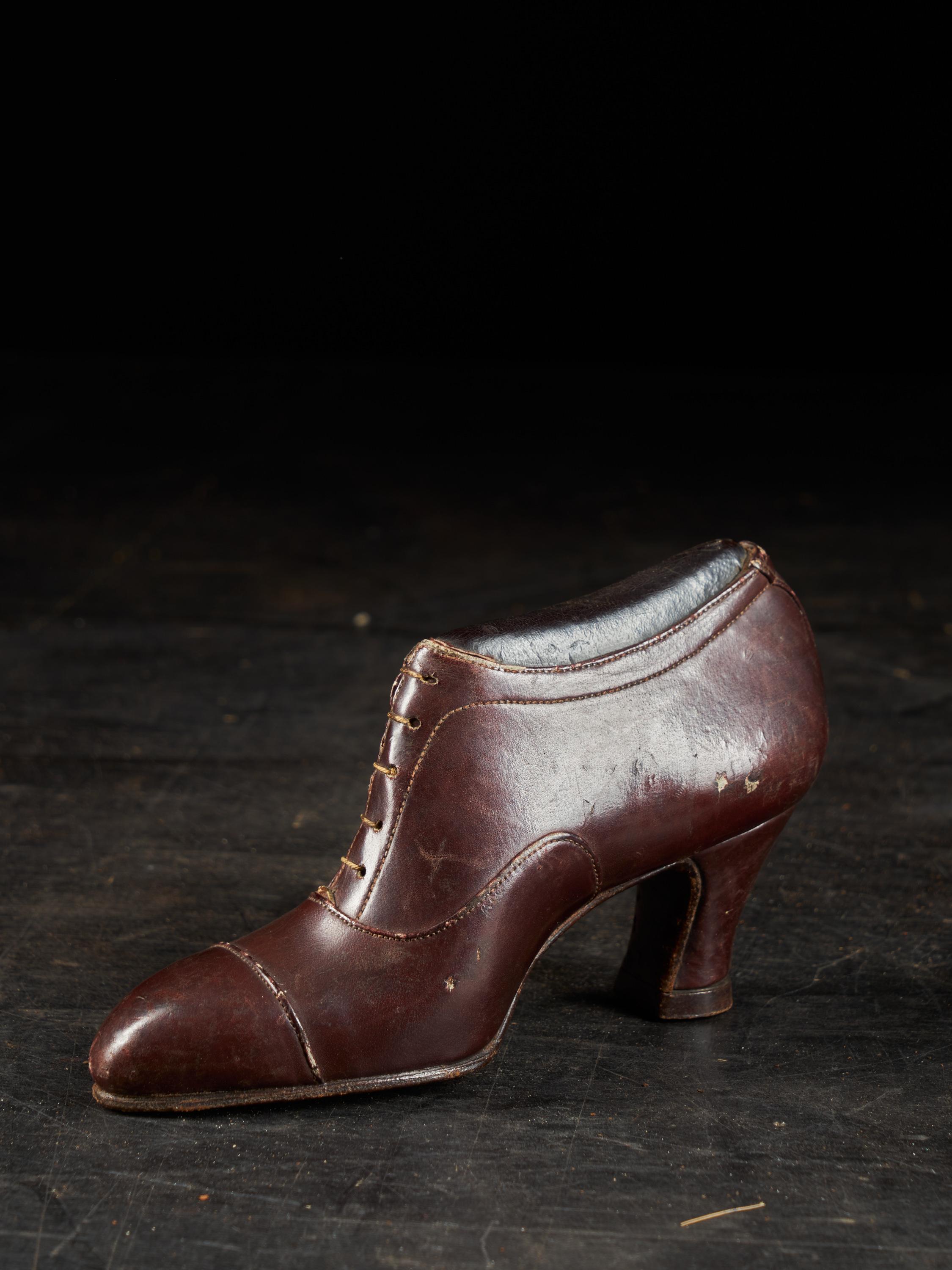 These three shoes were used by a shoemaker as basic show models from which customers could choose. He would then manufacture a customized pair. The three model show age and use related patina.

Measures: Between 11 x 5.5 x 6 and 17 x 5.5 x 9.