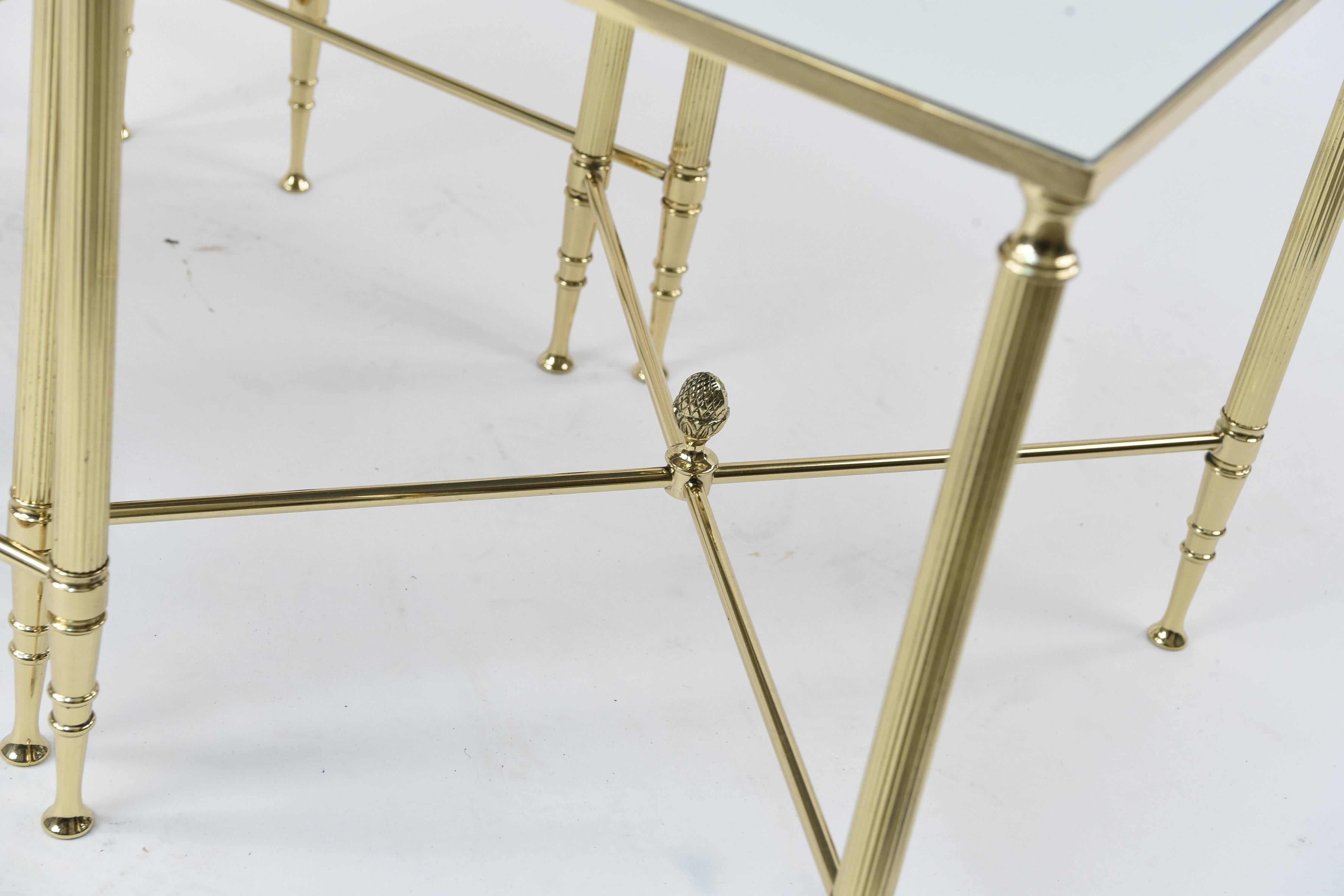 High style with this set of polished brass and mirrored nesting tables! A very sleek and Classic design, these tables will highlight any living room!