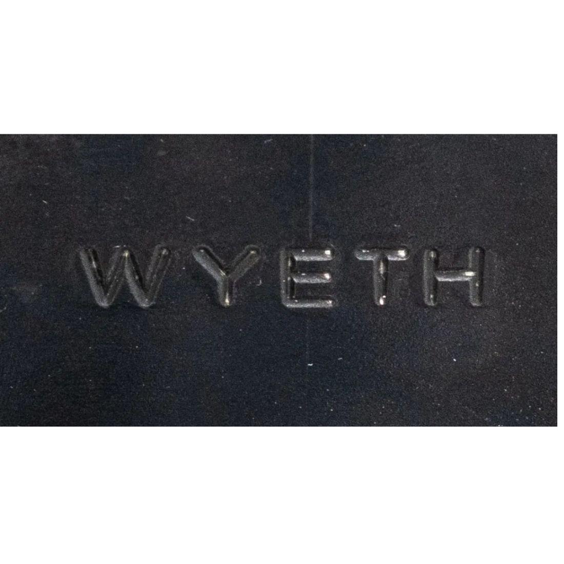 A set of three leather swivel barstools from Wyeth.  Crafted of midnight blue leather in an industrial modern style on a steel base that swivels making them a perfect marriage of style and function.