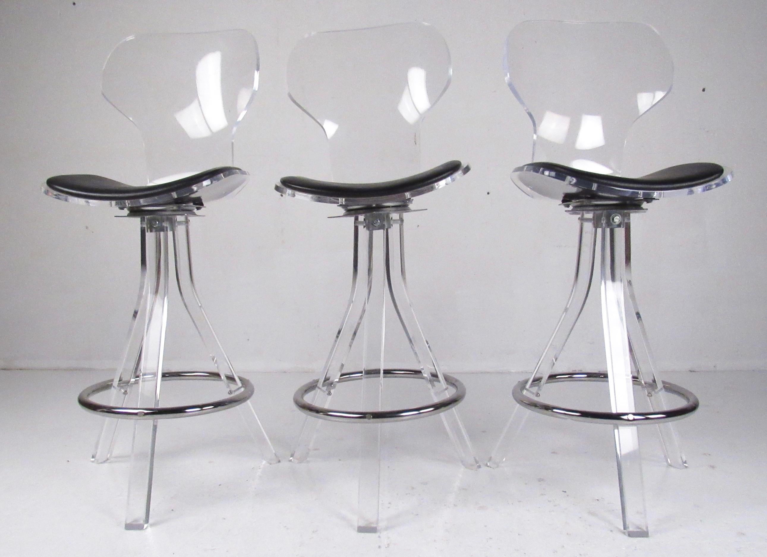This stylish set of modern bar stools features acrylic construction with padded vinyl seats. Comfortable shapely seatbacks add midcentury style to home or business bar or counter seating. Seat height is 29 inches high, swivel seats. Please confirm