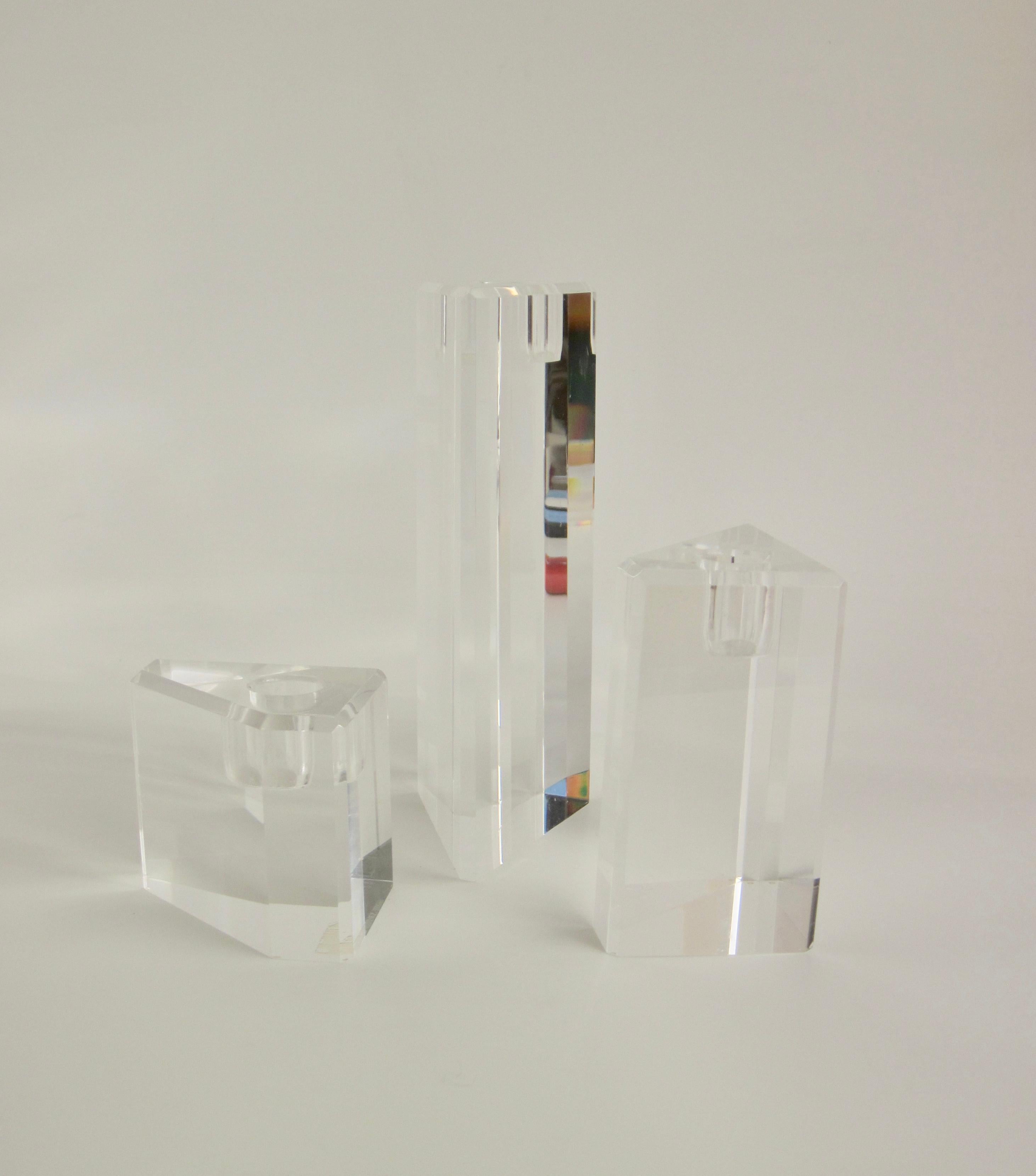 Three lucite candlesticks in graduated height and geometric form. Can be configured in multiple ways.

Medium Form Measurements: 3.88