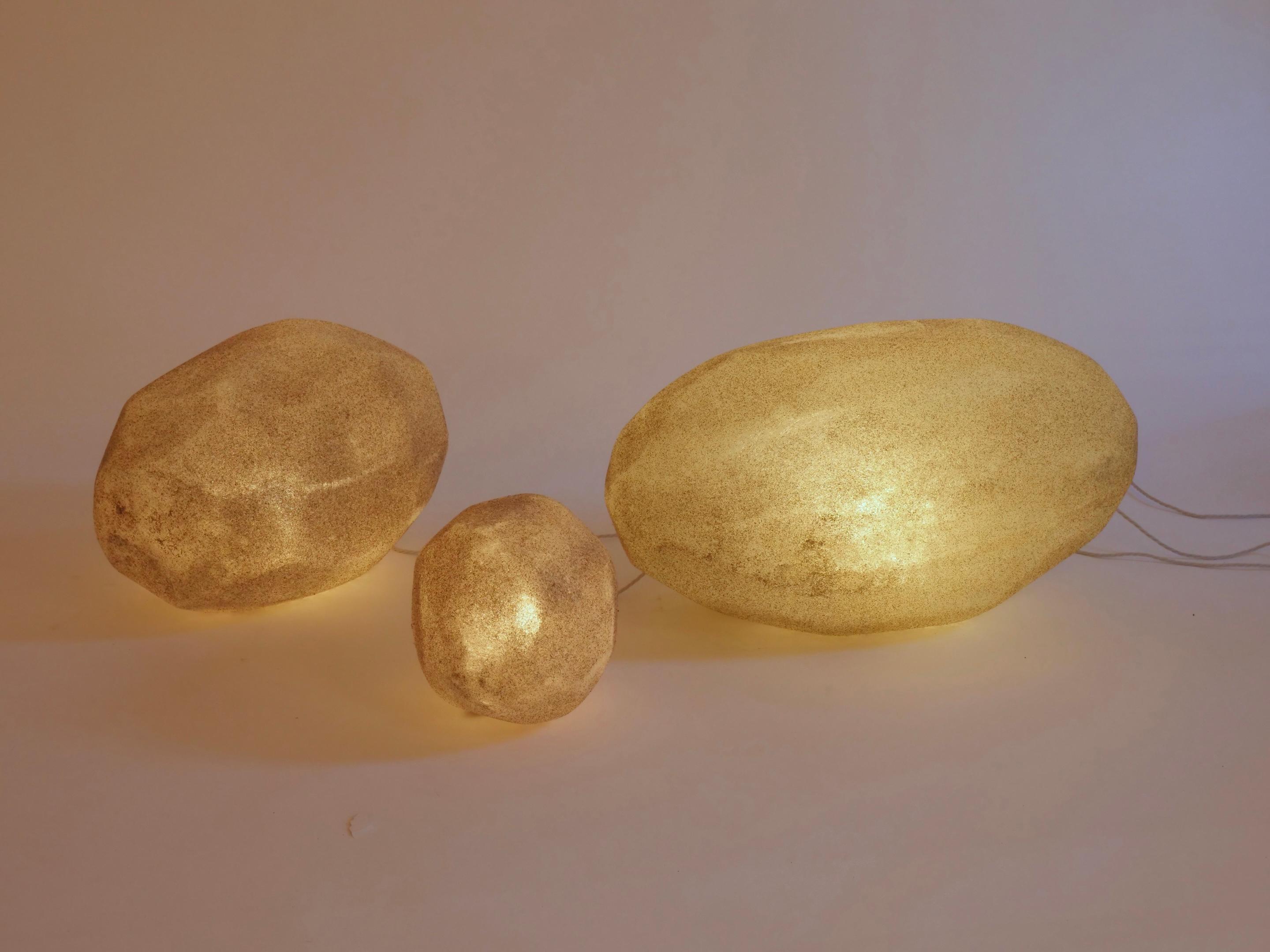 A set of three moon rock lamps. Natural rock shape fiberglass with marble dust.

Largest lamp dimensions
29.5