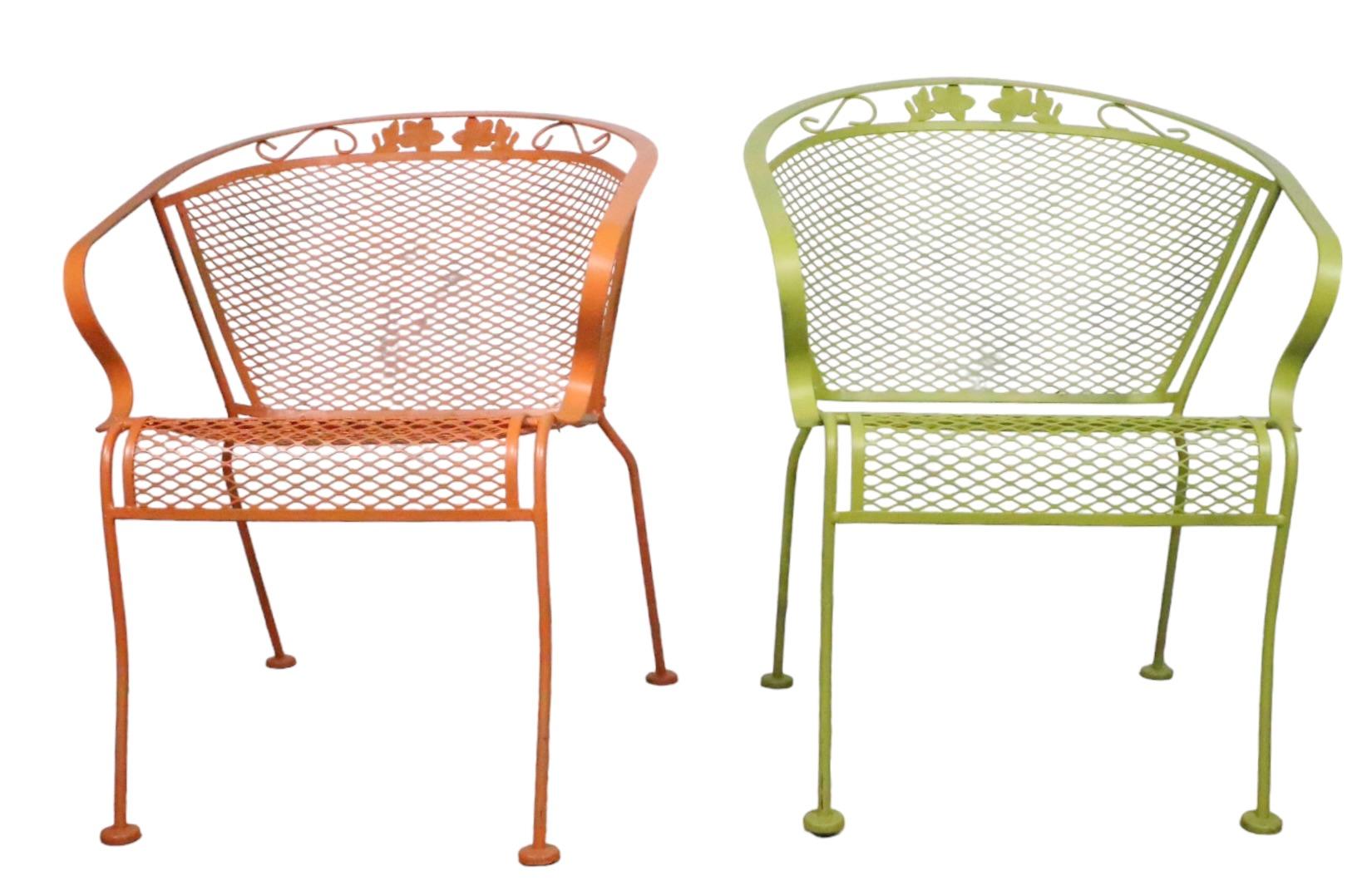 Fun set of three vintage garden, patio, poolside chairs, having a wrought iron frame. with metal mesh seats and backs. The chairs are turquoise, orange and green. All are structurally sound and sturdy, all show minor cosmetic wear to the paint