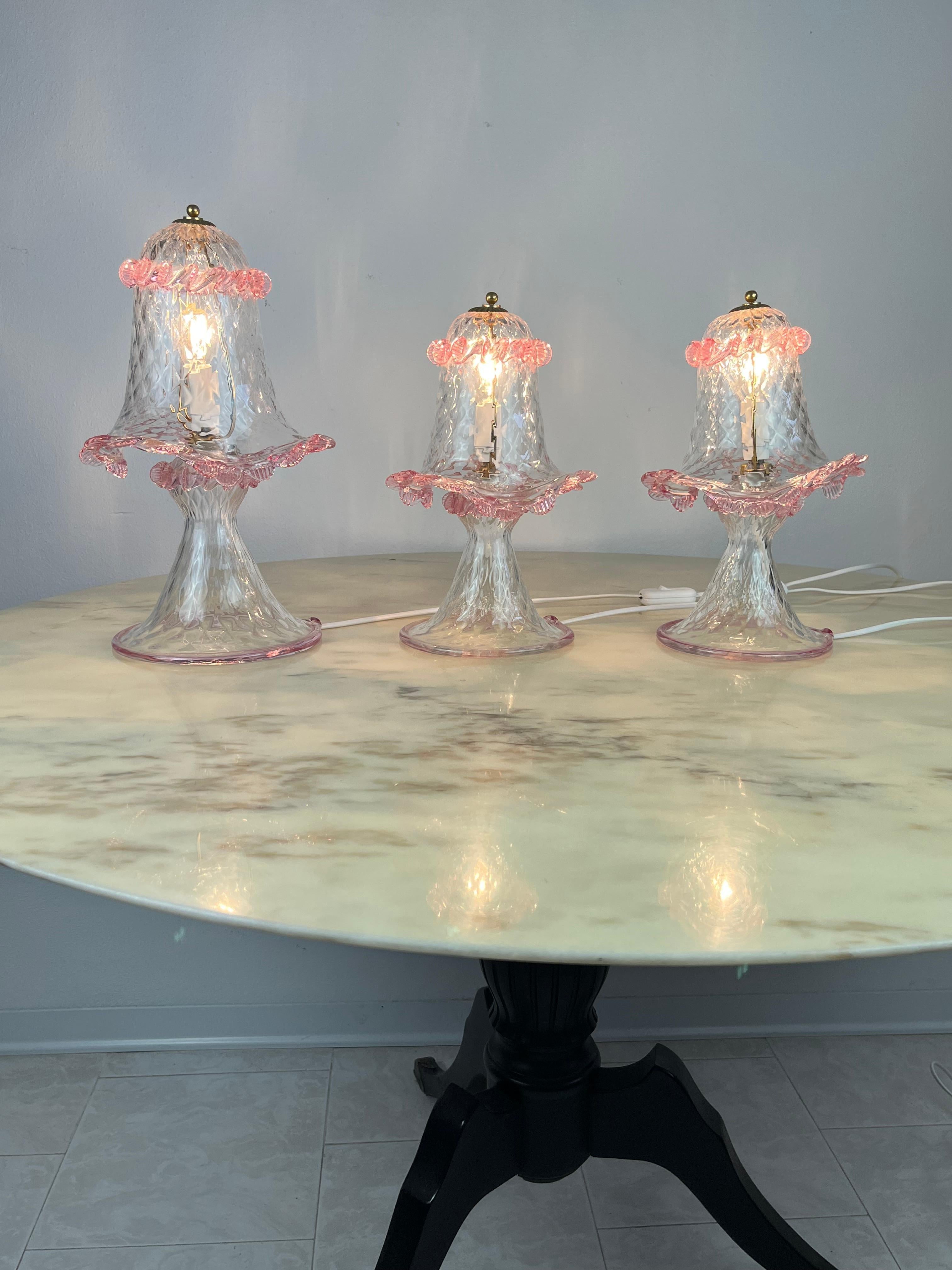 Set of three Murano lamps, Italy, 1980s.
Ideal for the bedroom.
The large one measures 38 cm and has a diameter of 22 cm. The two small ones, for bedside tables, Measure 30 cm with a diameter of 16.
Intact and functional, they are in excellent