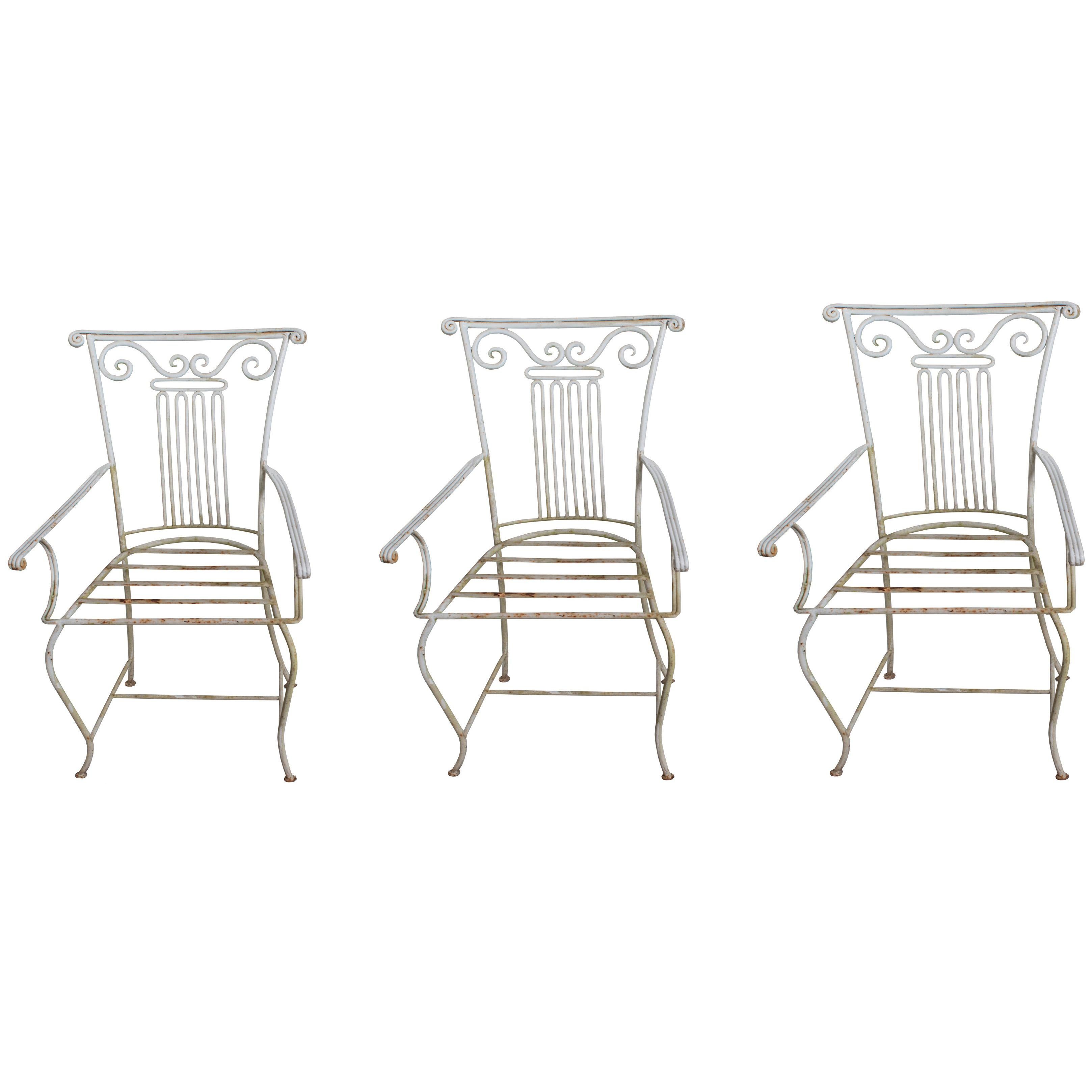 Three Neoclassical Wrought Iron Garden Chairs sold individually For Sale