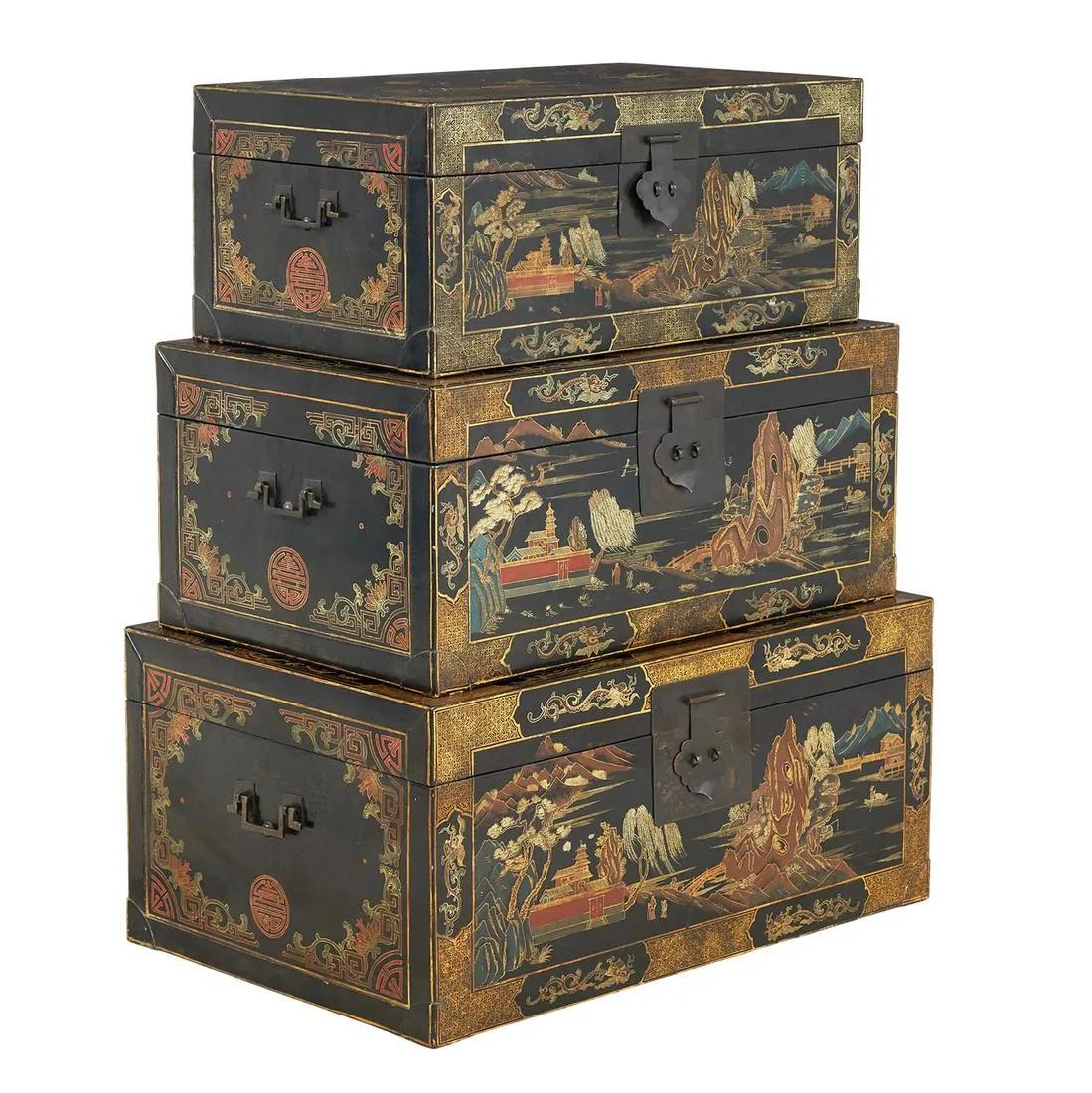 Set of three nested Chinese ebonized trunks,
circa 1900

The China Trade trunks are each of rectangular form with gilt and polychrome painting of birds and flowers and landscape scenes on a black ground, all with decorative hardware and carrying