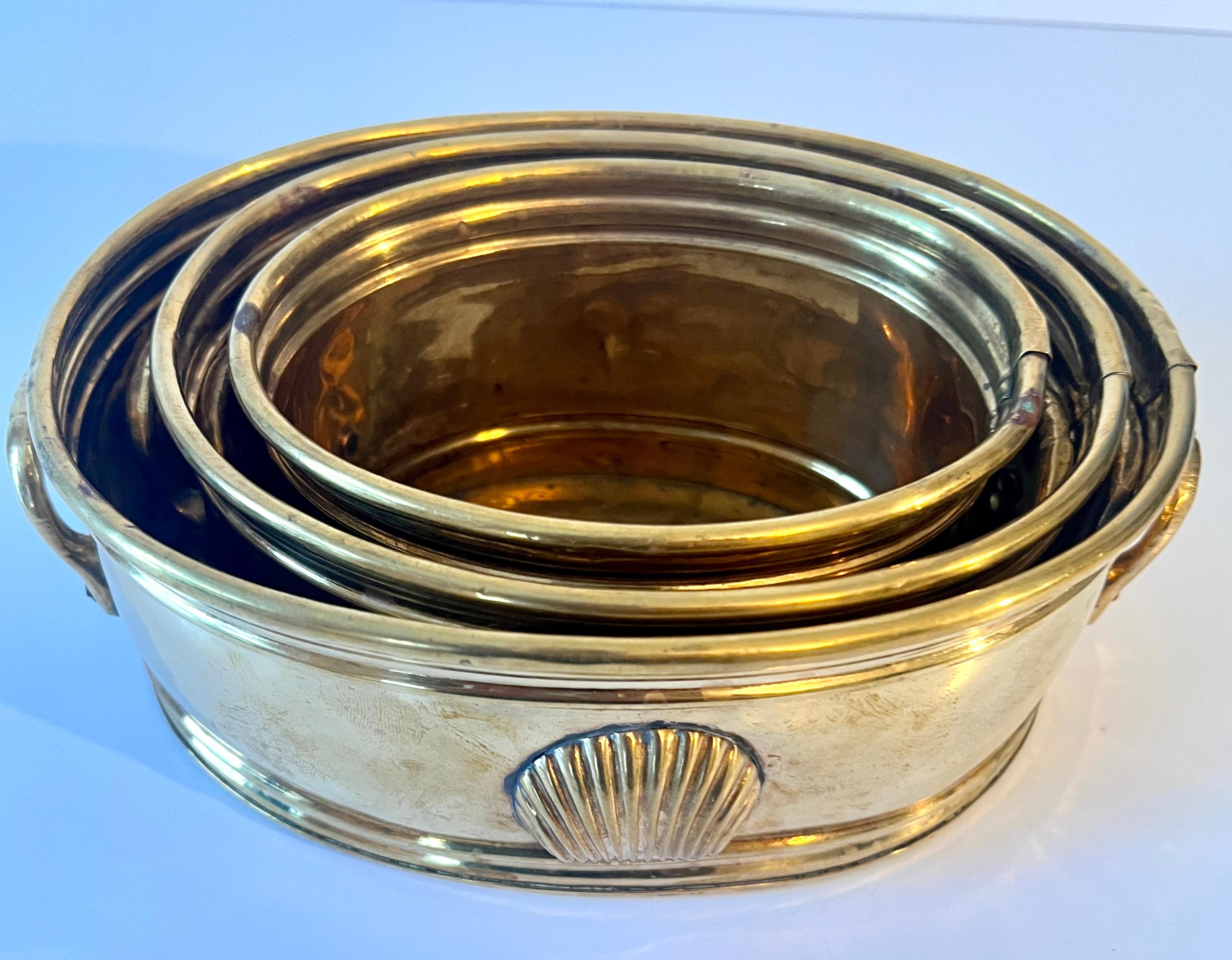 A beautiful set of three brass containers that all next inside each other.  Apart they are perfect for use as planters, floral arrangements, desk accessories, mail, and the list goes on.

A compliment to any space and also each one has a lovely clam