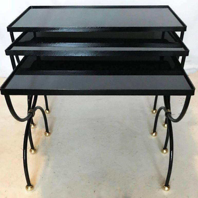 Set of three nesting tables attributed to Jean Royère dimensions: 1) 17 inches L, 12 inches W, 15 inches H 2) 19 inches L, 12 inches W, 17 inches H 3) 21 inches L, 12 inches W, 18 inches H.