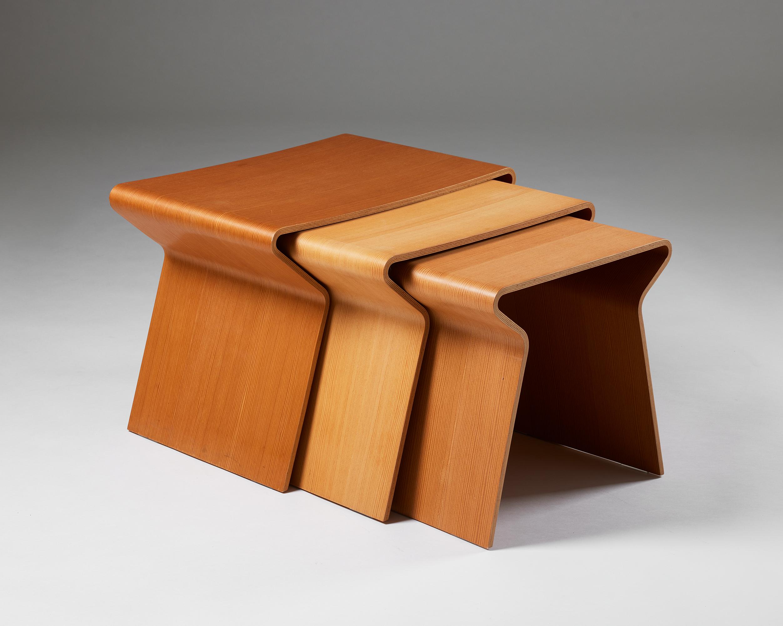 Set of three nesting tables designed by Grete Jalk for Lange Production,
Denmark, 1963.

The design is by Grete Jalk from 1963, and this set is was produced as a limited edition by Lange in 2008.

Oregon pine.

Stamped.

Small
H: 38 cm / 15''
W: 38
