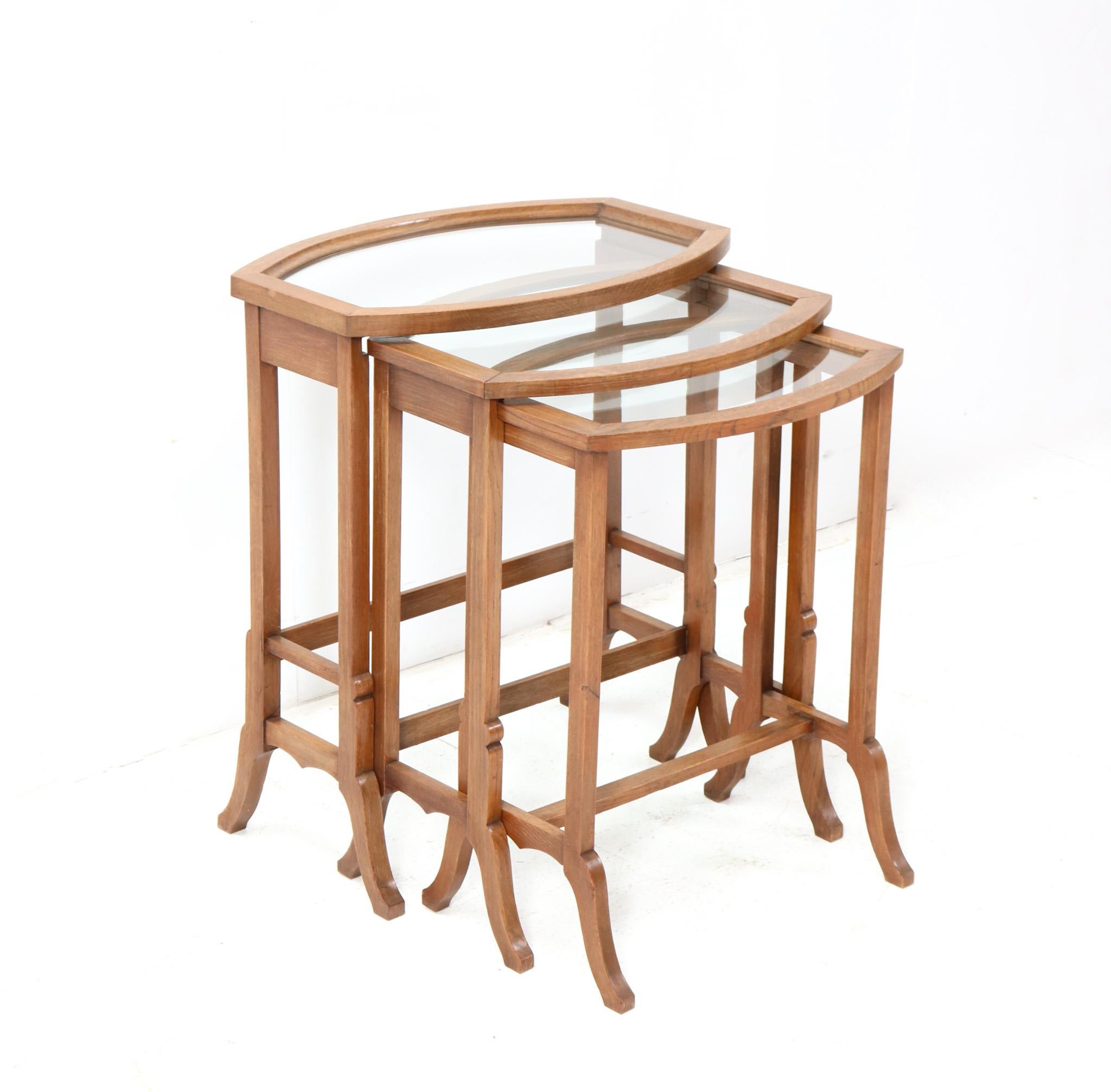 Early 20th Century Set of Three Oak Art Nouveau Nesting Tables with Glass Tops For Sale