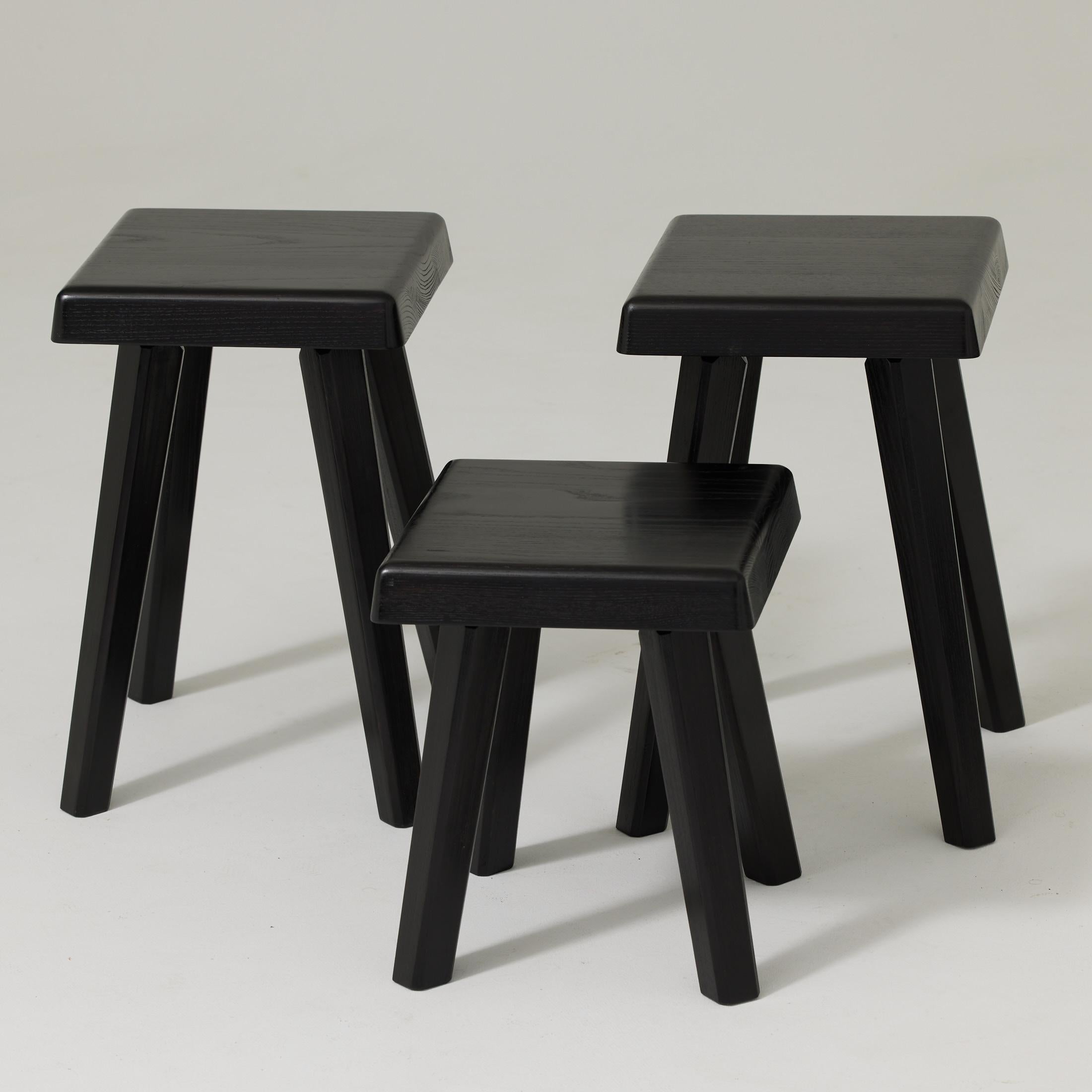 Set of Three Stools designed by Pierre Chapo in 1960s.
Manufactured in France around 2019

Solid oakwood.
Measures: small: 28 x 28 x 34 cm
Tall: 31 x 31 x 45 cm

In good original condition, with minor wear consistent with age and use, preserving a